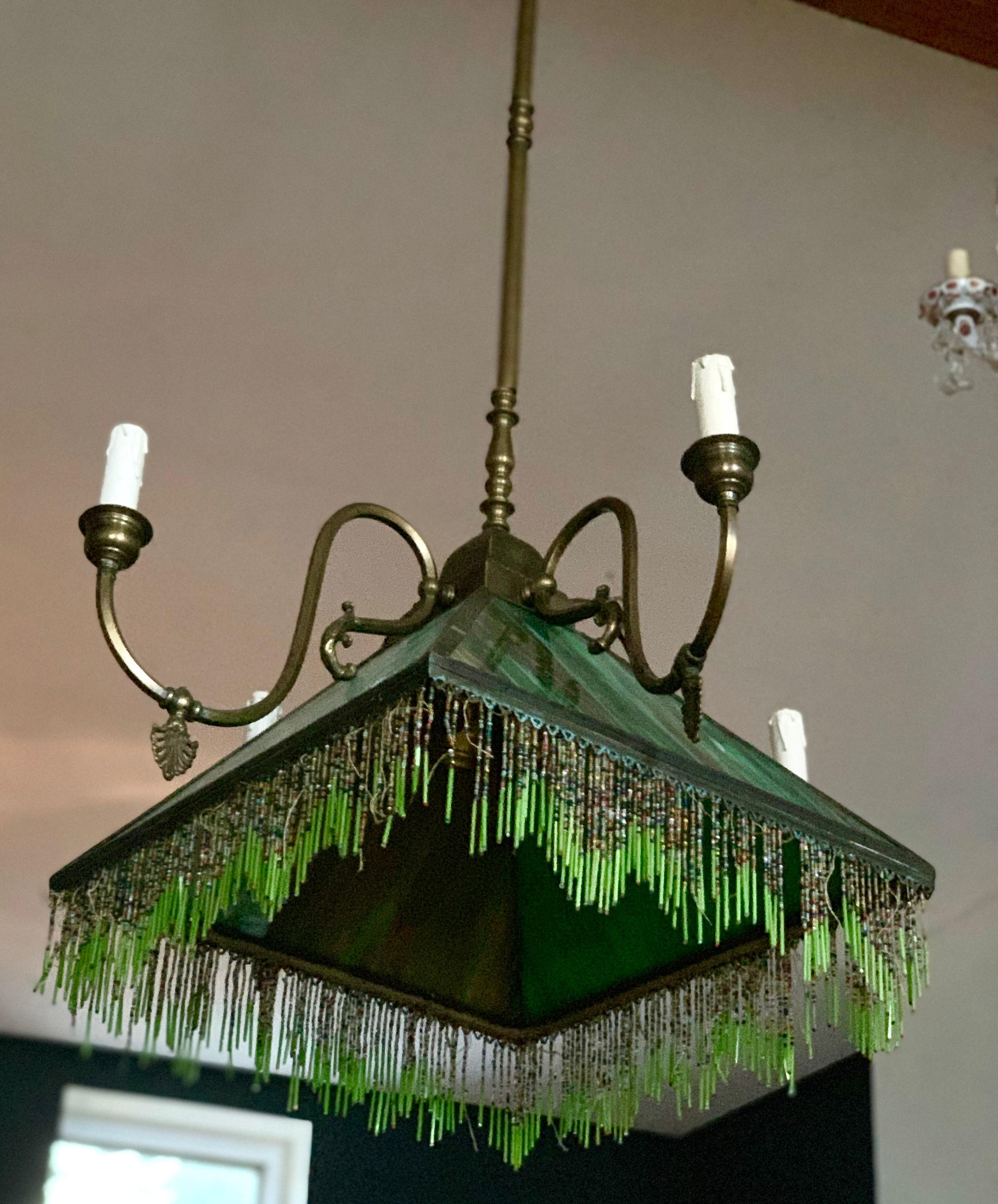 Mission slag glass light fixture, early 20th century. Beaded fringe. Dimensions: 37