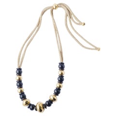 Collana vistosa Missoni in oro giallo 18 carati e perline nere - anni '80