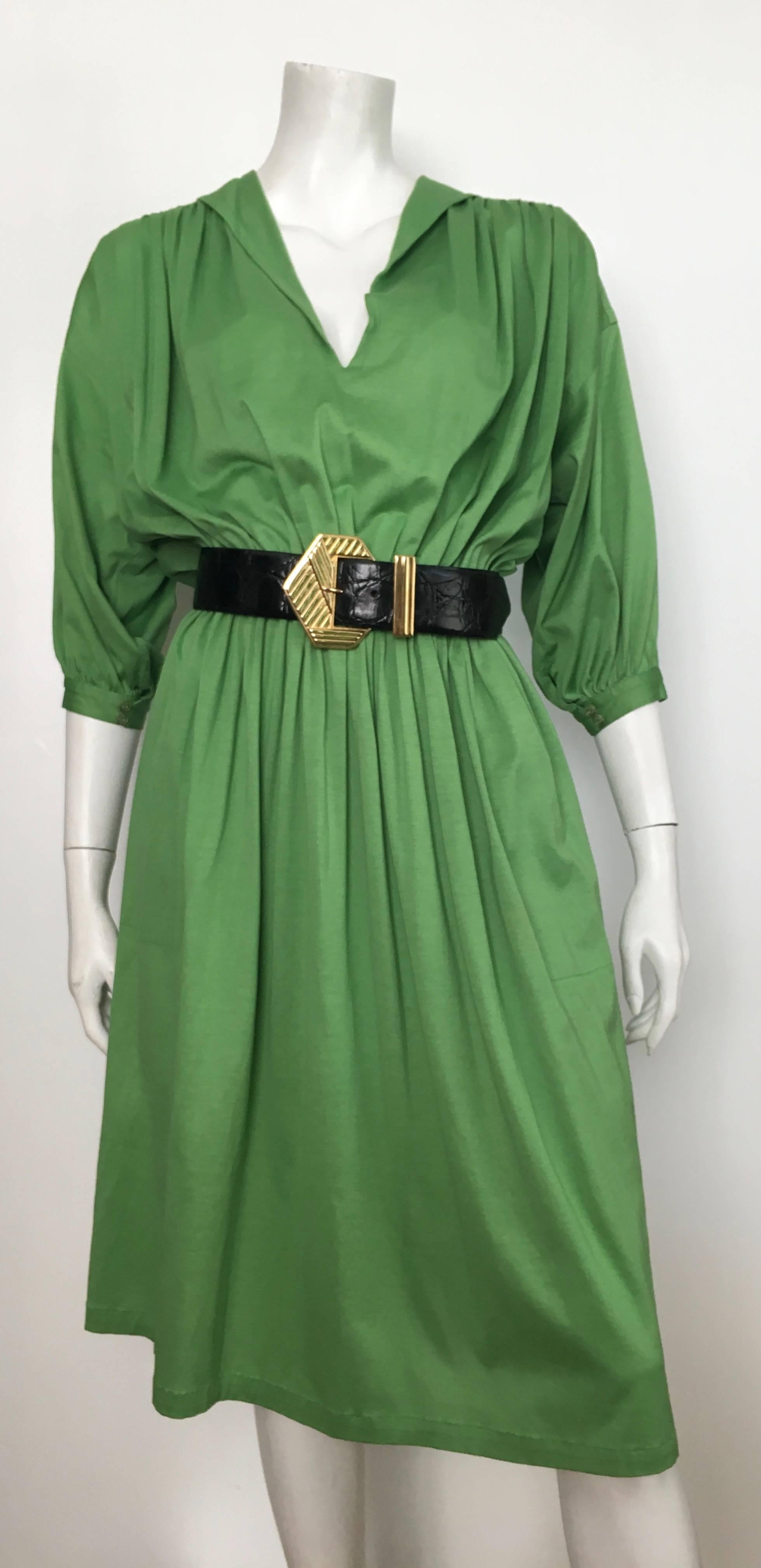 Missoni 1980s green cotton short sleeve casual day dress with pockets is a size small.  This dress is photographed on Matilda the Mannequin and she is a size 4 but since it has an elastic waistband it will go to a size 6.  Ladies please grab your