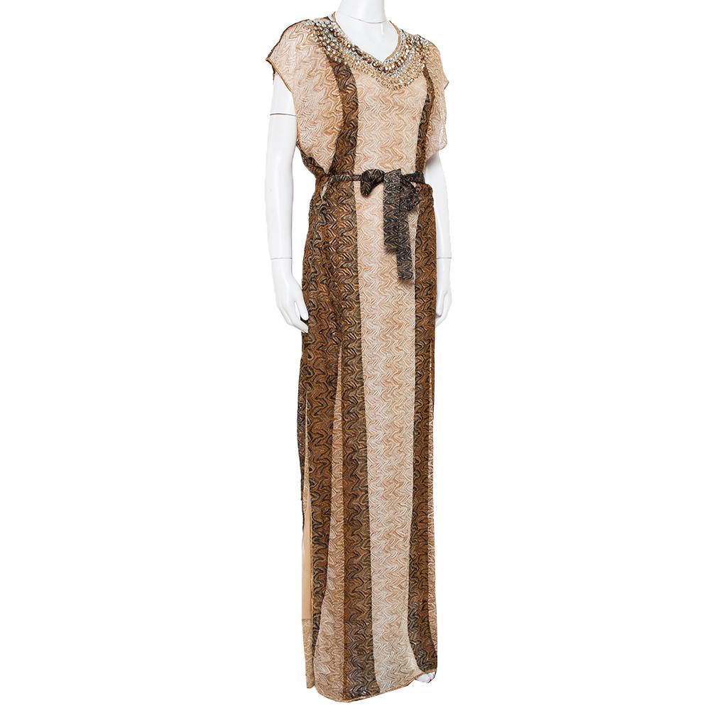 You know it's the best knitwear when it is from Missoni! Made from a blend of fabrics, this maxi dress features a lurex knit design with pretty embellishments around the neckline and a belt at the waist. Pair it with flats and a cute bag for an