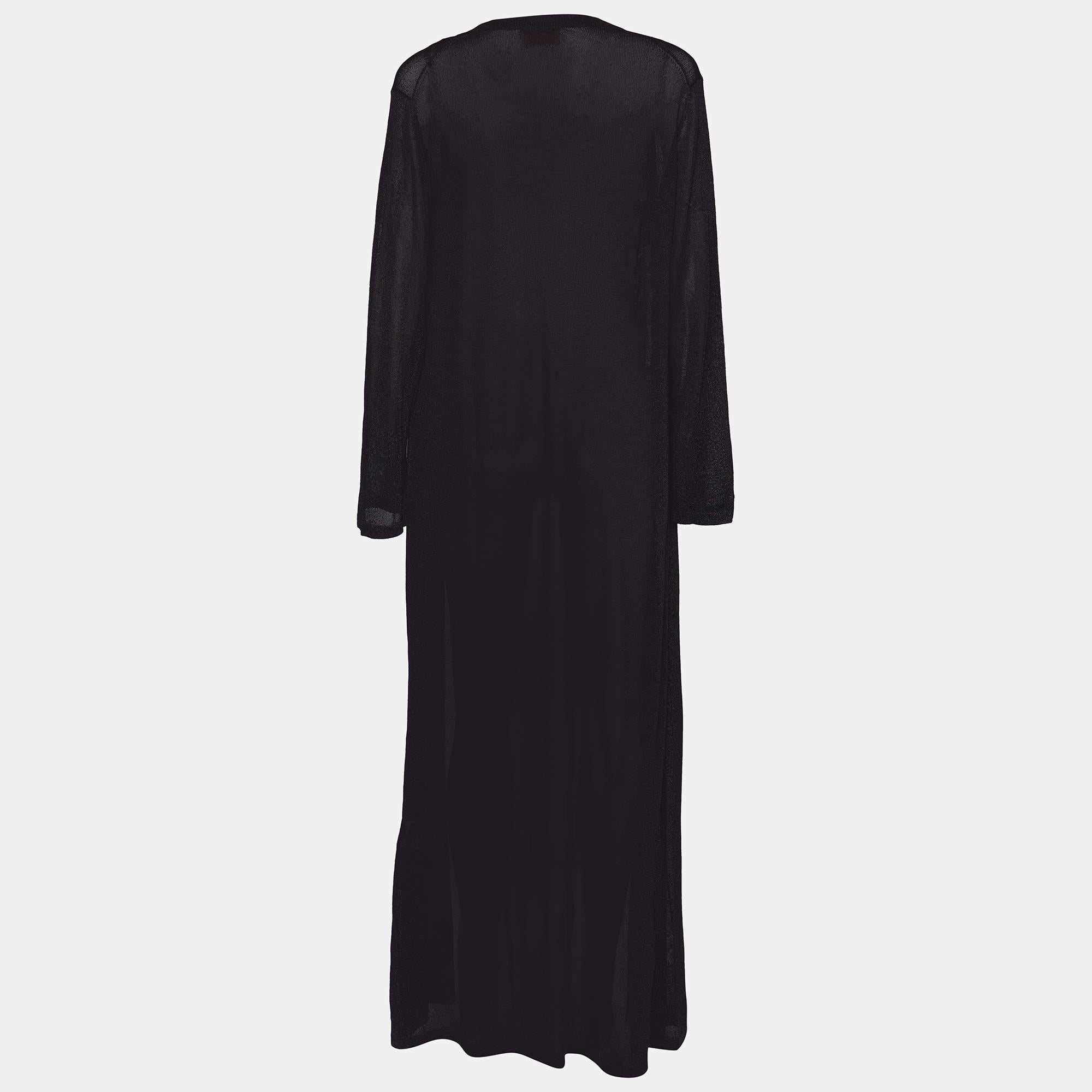 Introducing the Missoni Black Lurex Knit Open Front Long Shrug, the epitome of elegance and style. Crafted with premium black lurex knit, this versatile piece effortlessly adds a touch of glamour to any outfit. Its open front design and long length