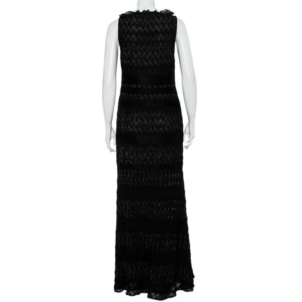 This black sleeveless dress by Missoni displays a combination of sophistication and charm. This lurex knit attire features a ruffled V-neck to highlight your collarbones. The maxi dress has a glittery effect and an elegant silhouette.

