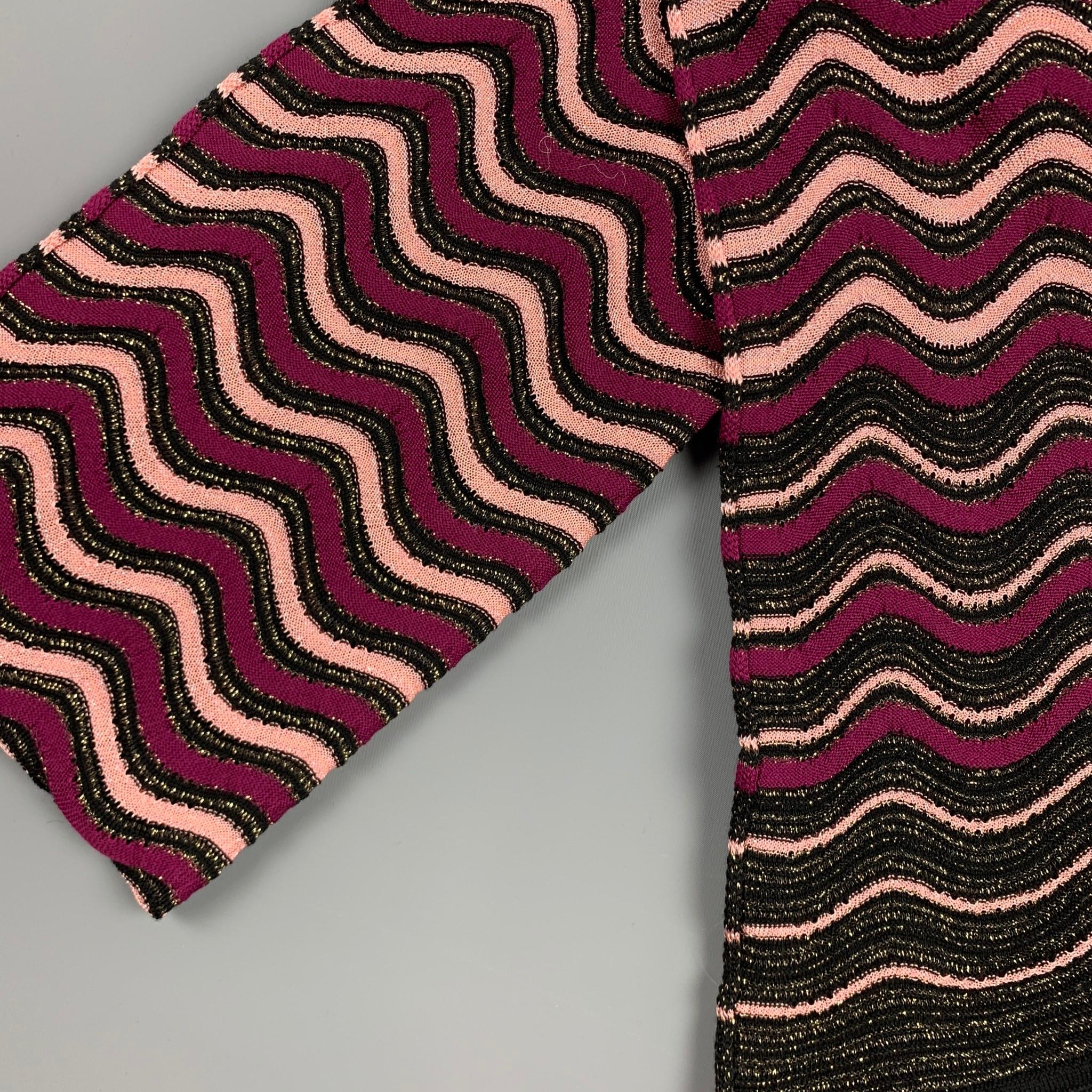 MISSONI scarf comes in a black & purple woven shimmery material. Made in Italy.

Very Good Pre-Owned Condition.

Measurements:

76 in. x 17 in. 