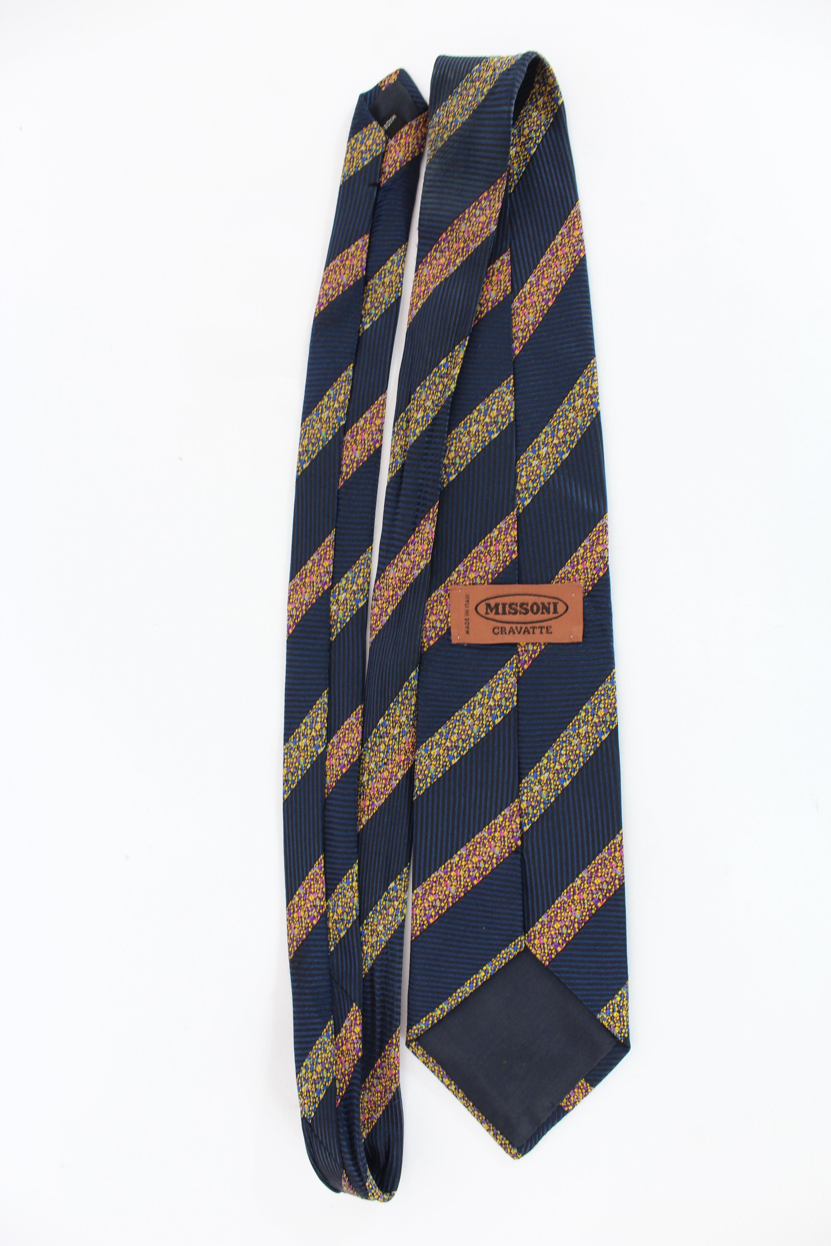 Missoni 90s vintage regimental tie. Blue color with yellow and purple lines. 100% silk. Made in Italy.

Length: 150 cm
Width: 9 cm