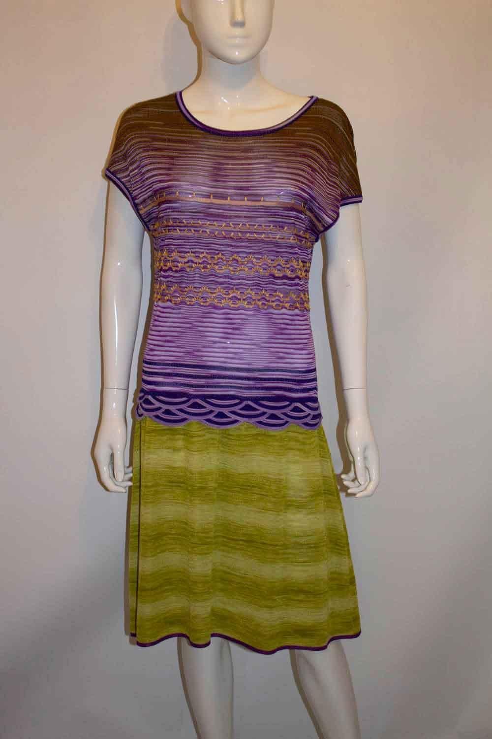 A chic and easy to wear dress by Missoni, brown label/main line. The dress is in a wonderful colour combination , with a lilac and orange top , and green skirt. The dress is unlined. Size 44
Measurements: Bust up to 38'', length 39''
