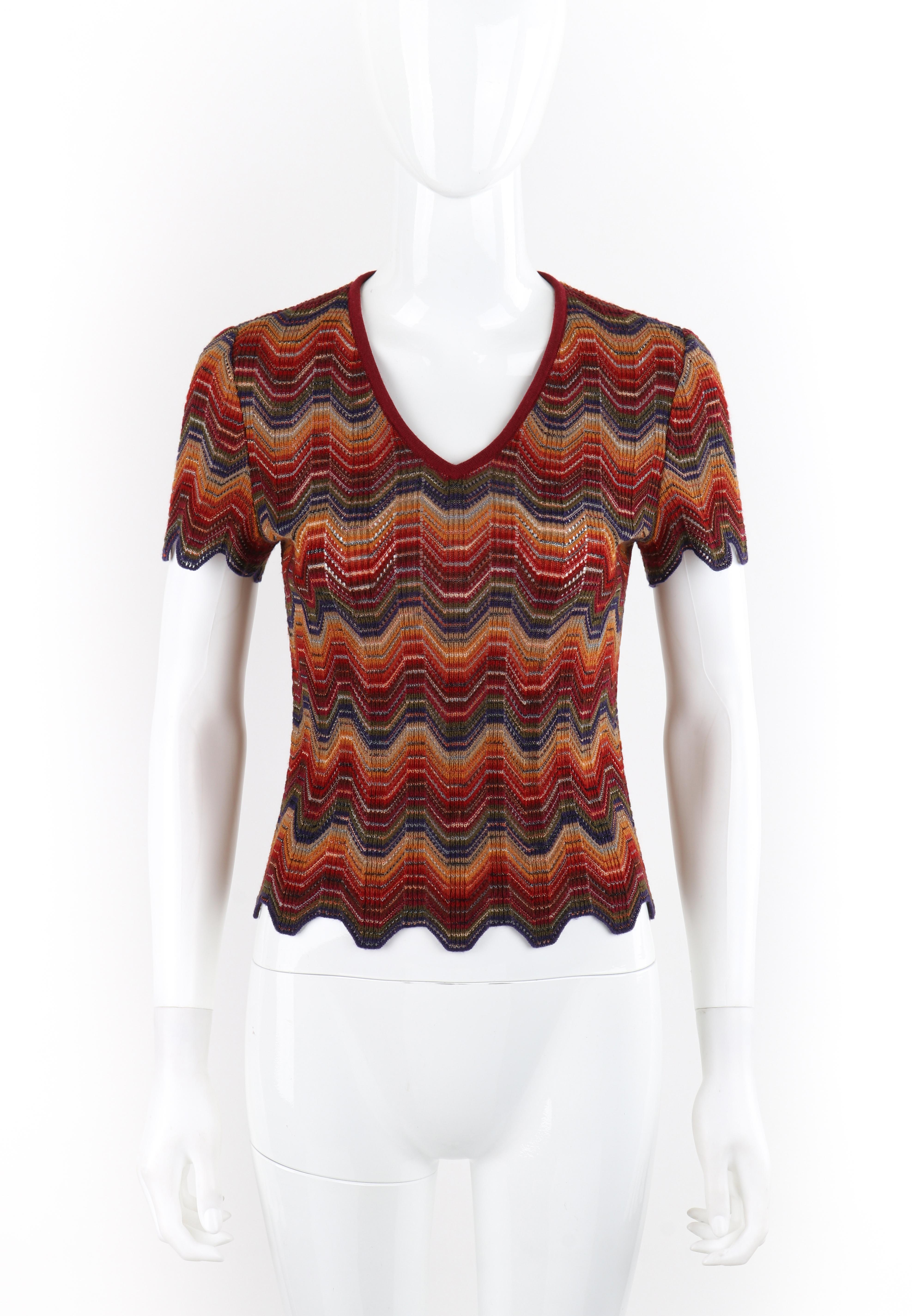 Brand / Manufacturer: Missoni
Circa: 1970s
Style: Short sleeve top
Color(s): Shades of red, orange, yellow, green, blue, white
Lined: No
Marked Fabric Content: 