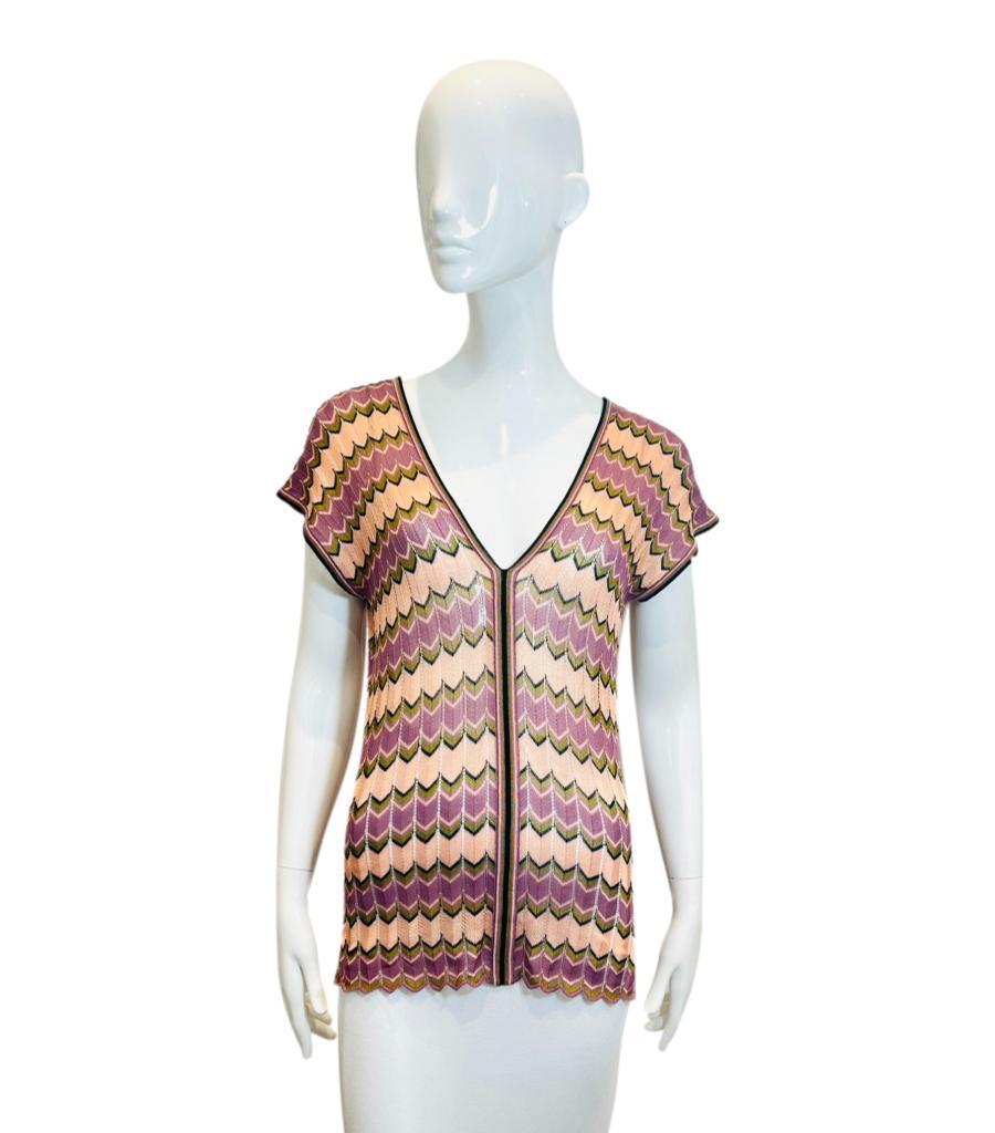 Missoni Chevron Pattern Knitted Cotton Top

Multicoloured knitwear designed with the brand's signature chevron pattern.

Featuring deep V-Neck to the front and rear, short sleeves and longline fit.

Size – 40IT

Condition – Very Good

Composition –