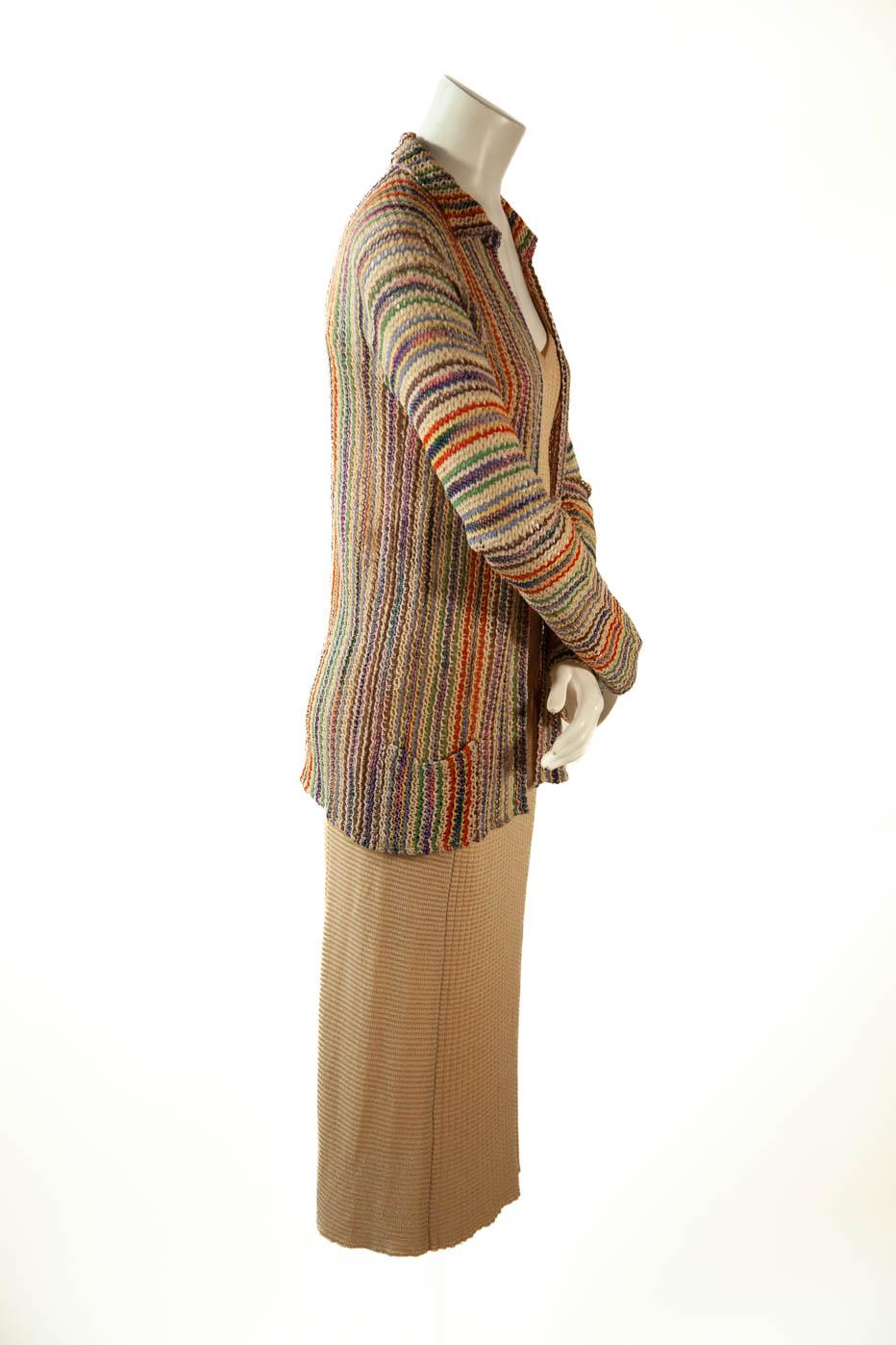 Missoni, circa 1973 (verified), three (3) piece knit ensemble. Ribbed cream v-neck camisole and long skirt with long sleeve multi-color rayon and cotton knit cardigan with patch pockets.

Label 