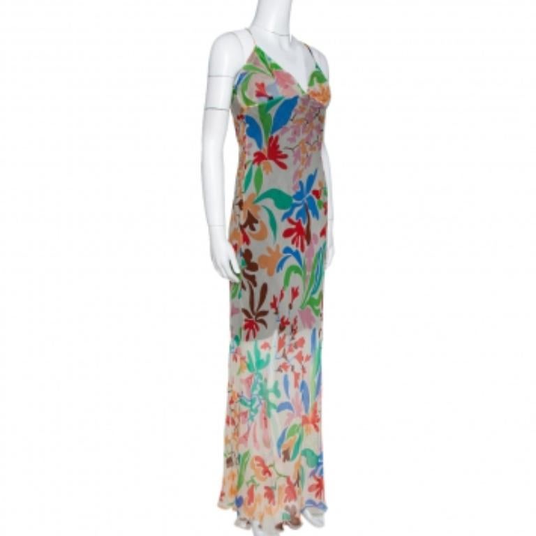 Finely tailored and skillfully designed is this maxi dress from the house of Missoni. The cream creation features a flattering silhouette and is decorated with a lovely floral print all over. It has a deep V-neckline and noodle shoulder straps. It
