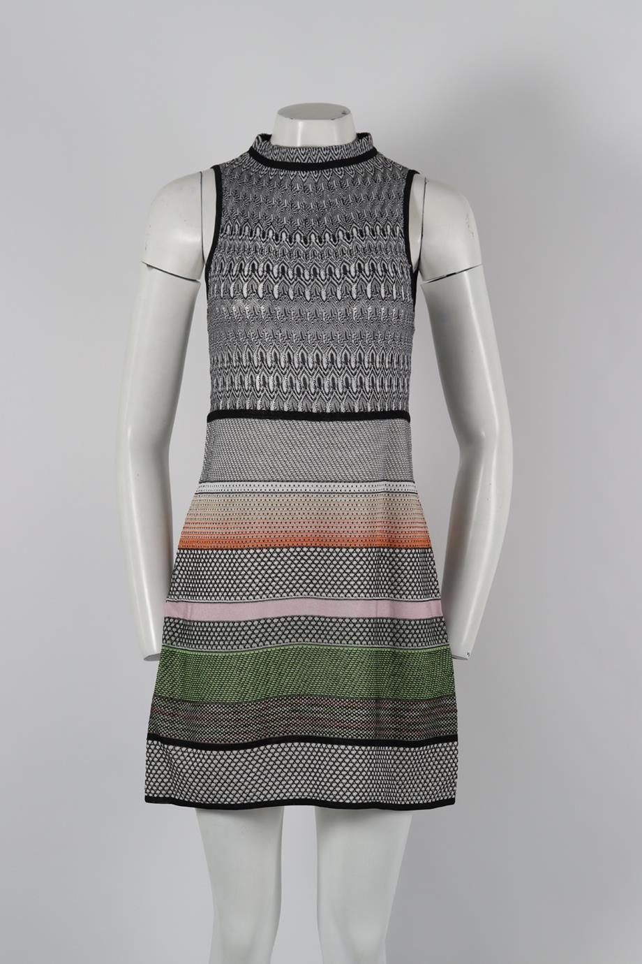 Missoni Crochet Knit Mini Dress. Black, white, pink and green. Sleeveless. Crewneck. Tie fastening - Back. 73% Rayon, 12% polyester, 7% acetate, 5% nylon, 3% flax. IT 38 (UK 6, US 2, FR 34). Bust: 27.2 in. Waist: 30 in. Hips: 35.4 in. Length: 33.6