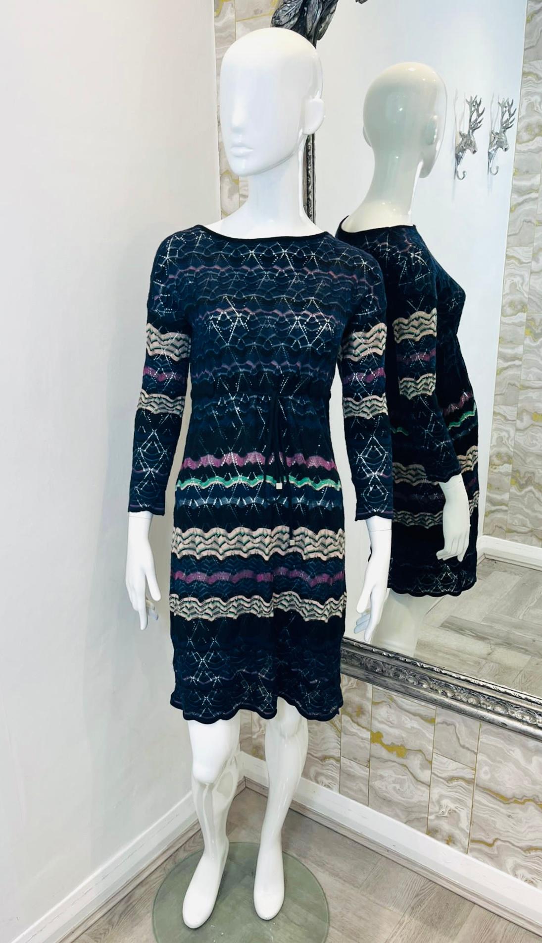 Missoni Crochet Knit Striped Dress

Navy dress designed with the brand's signature multicoloured zig zag stripe pattern.

Featuring boat neckline, three-quarter sleeves and mid-thigh length.

Styled with self-tie string belt to waist.

Size –