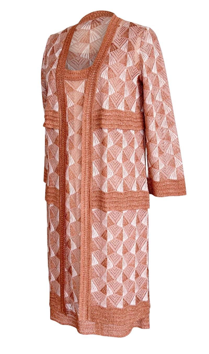 Guaranteed authentic Missoni dress with matching 3/4 sleeve long jacket.  
Sleeveless knit dress with scoop neck.
Beautiful coppery color metallic thread woven with soft white creating a Deco pattern.
Scoop neck sleeveless dress fully lined.  Lining