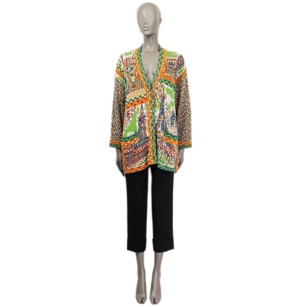 100% authentic Missoni knit cardigan in green, orange, off-white and red cotton (85%) and nylon (15%). Two slit pockets on the front. Closes with multi-colored buttons on the front. Unlined. Has been worn and is in excellent