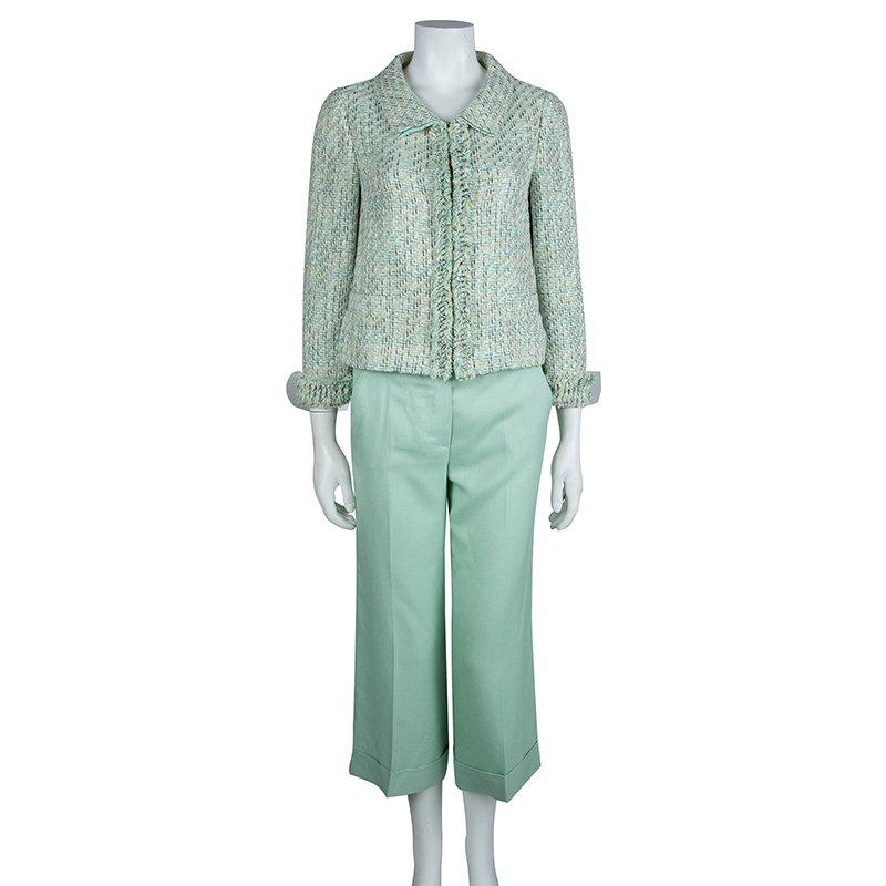Missoni’s take on the pant suit – the blazer of this set has a textured finish with a mixed weave design. Featuring a blend of pleasant green colours, it is complemented by solid coloured pants made from a smooth, soft fabric. The pants have folded