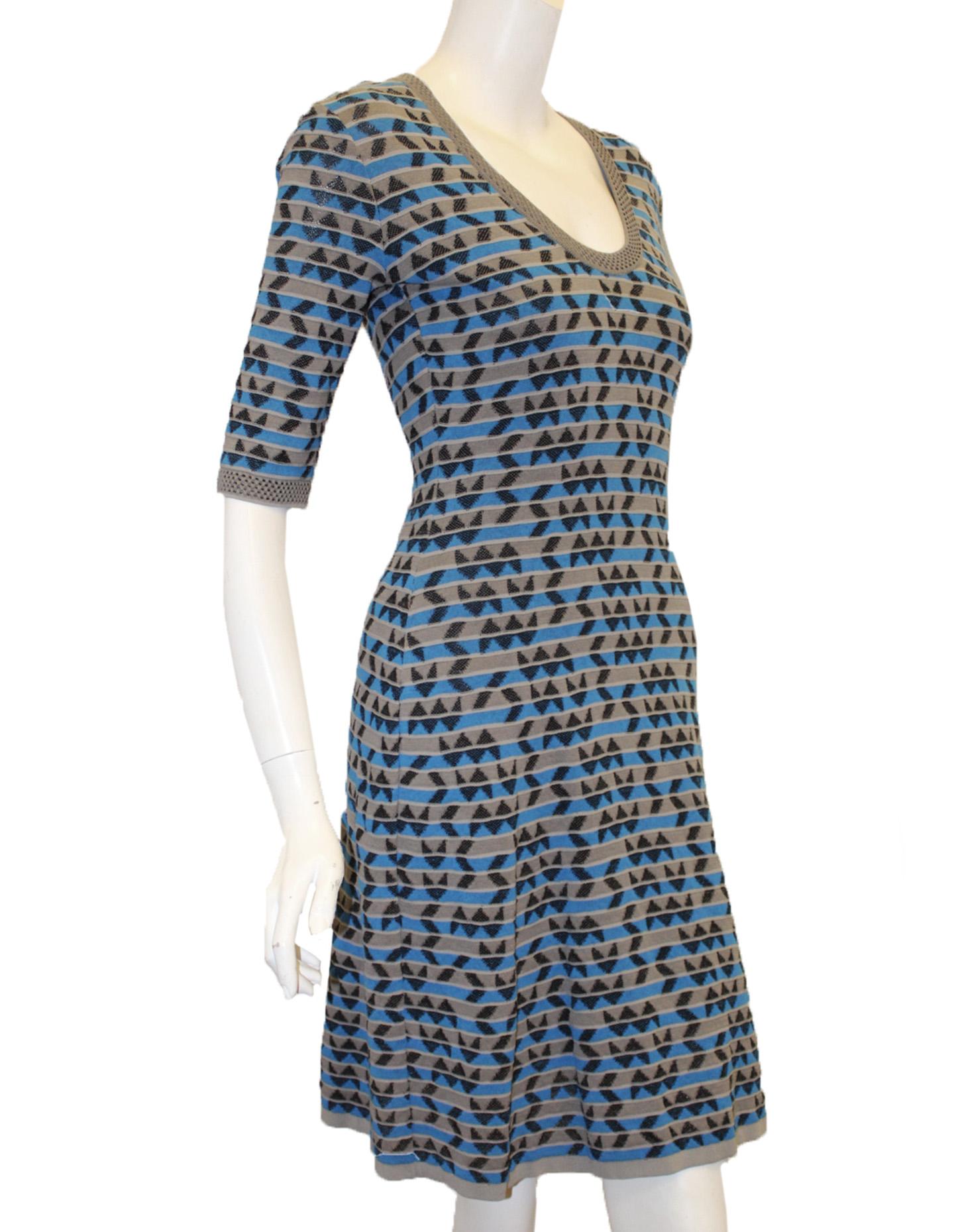 Missoni multi color modern geometric design dress in grey, turquoise and black contains a grey trim scoop neck and elbow length sleeves is your perfect companion for these warm summer days and night.  This easy to wear and travel with dress has a