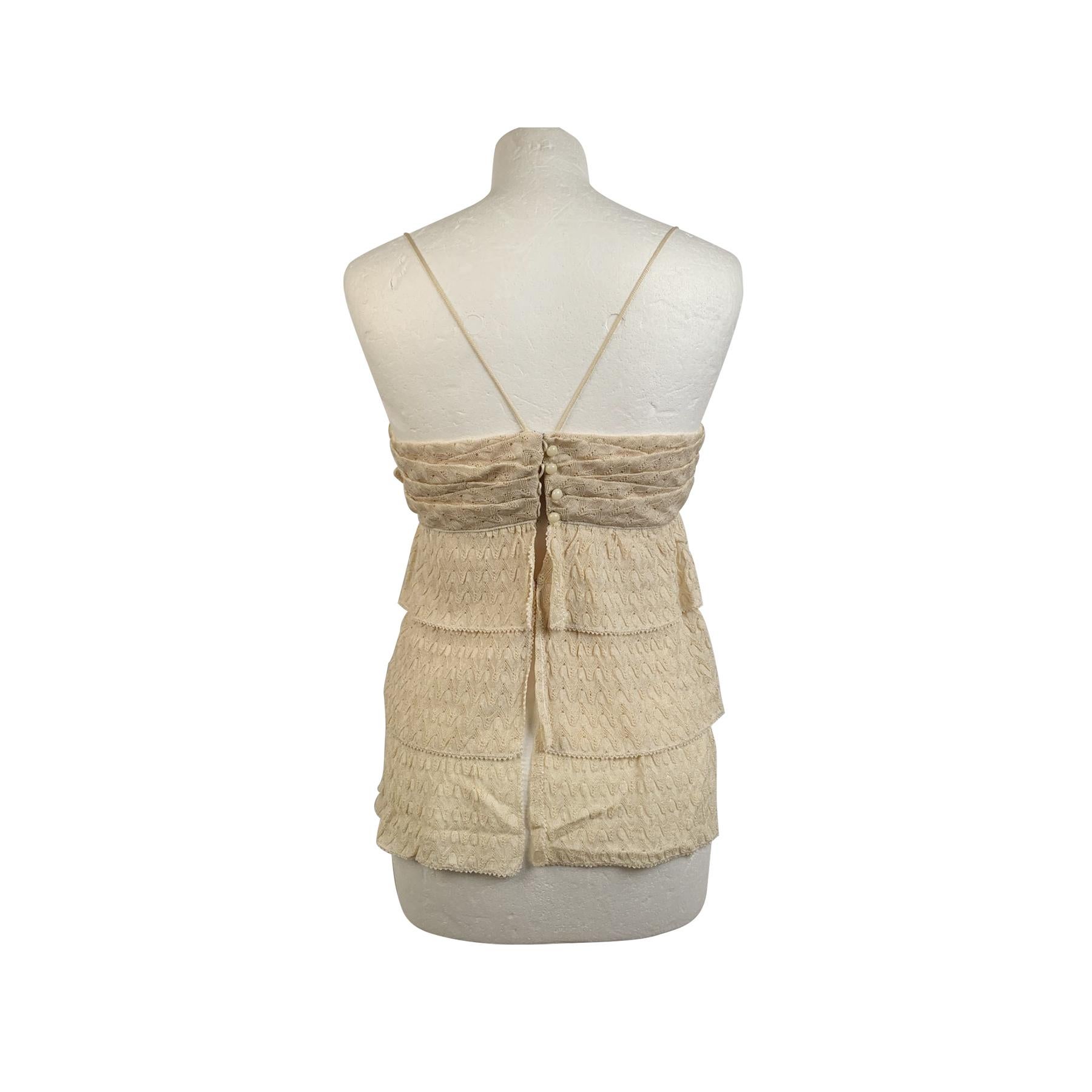 Missoni ivory viscose top. It features spaghetti strap. , flower application on the front, tiered design, button closure and hook and eyes on the back, Made in Italy. Size: 42 IT (The size shown for this item is the size indicated by the designer on