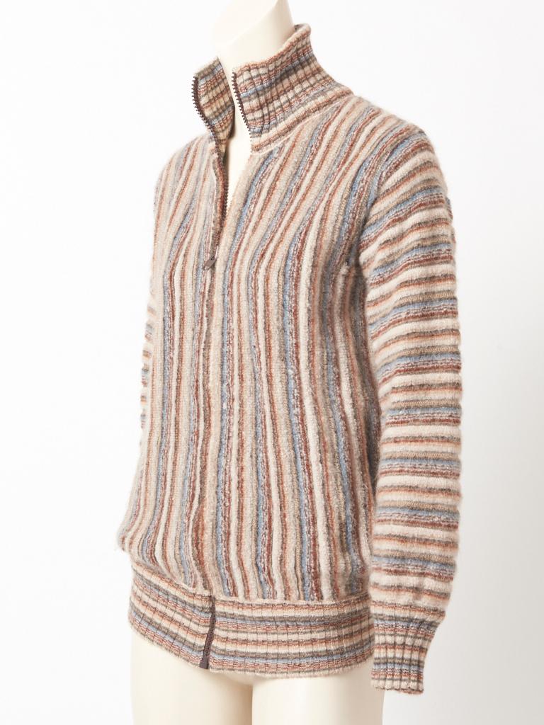 Missoni, neutral toned, wool knit, blouson jacket ,having a middle front zipper closure with a high collar , ribbed cuffs and hem, and vertical hidden side pockets. C. 1970's.