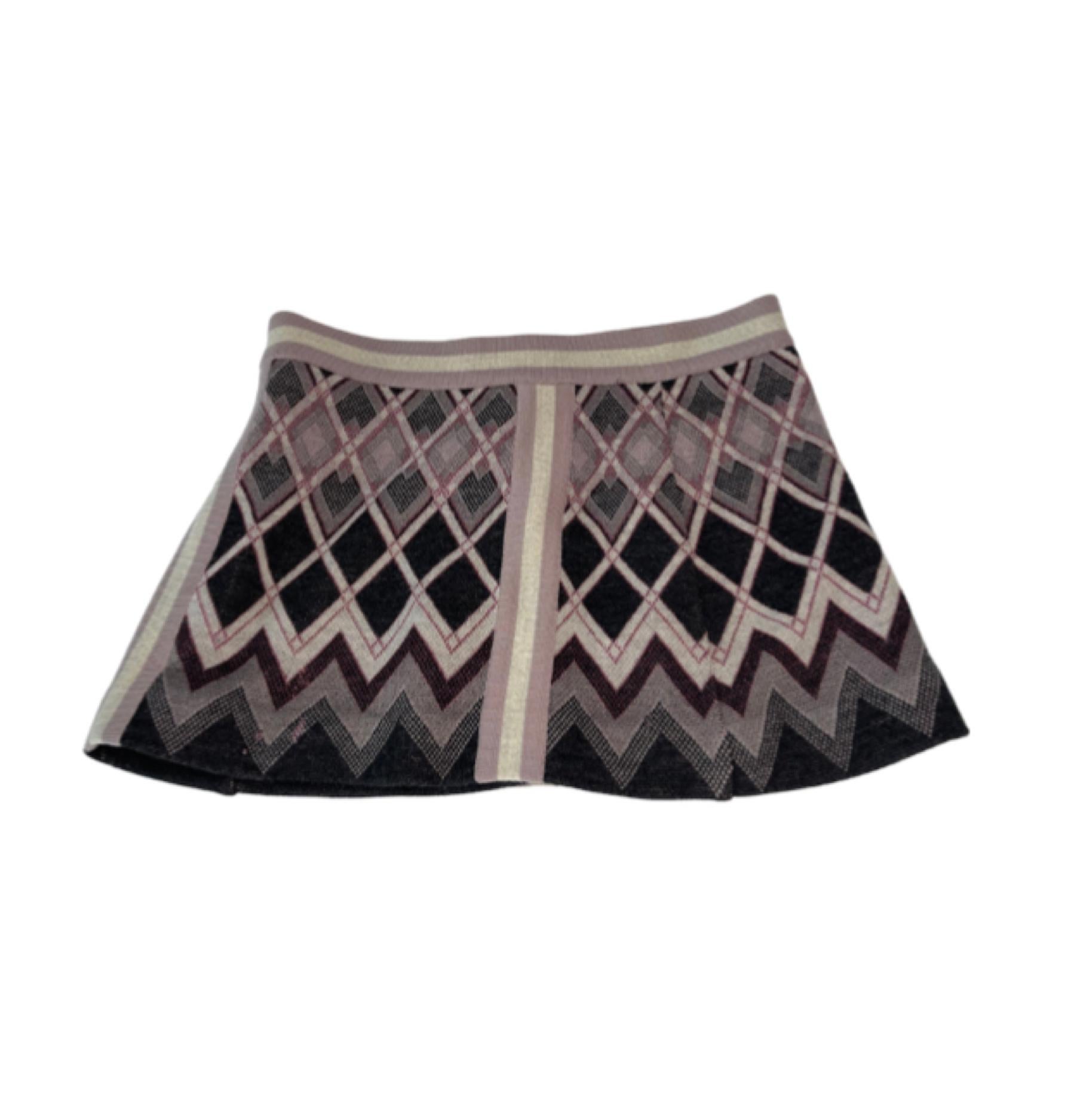Missoni Knit Micro Skirt, lavendar/multi. A cute classic that can be paired with a t-shirt in the summer, or black stockings and turtlenecks in the fall.

COLOR: Black and grey
MATERIAL: 70% wool, 30% viscose, LINING: 85% rayon, 15% elastane.
SIZE: