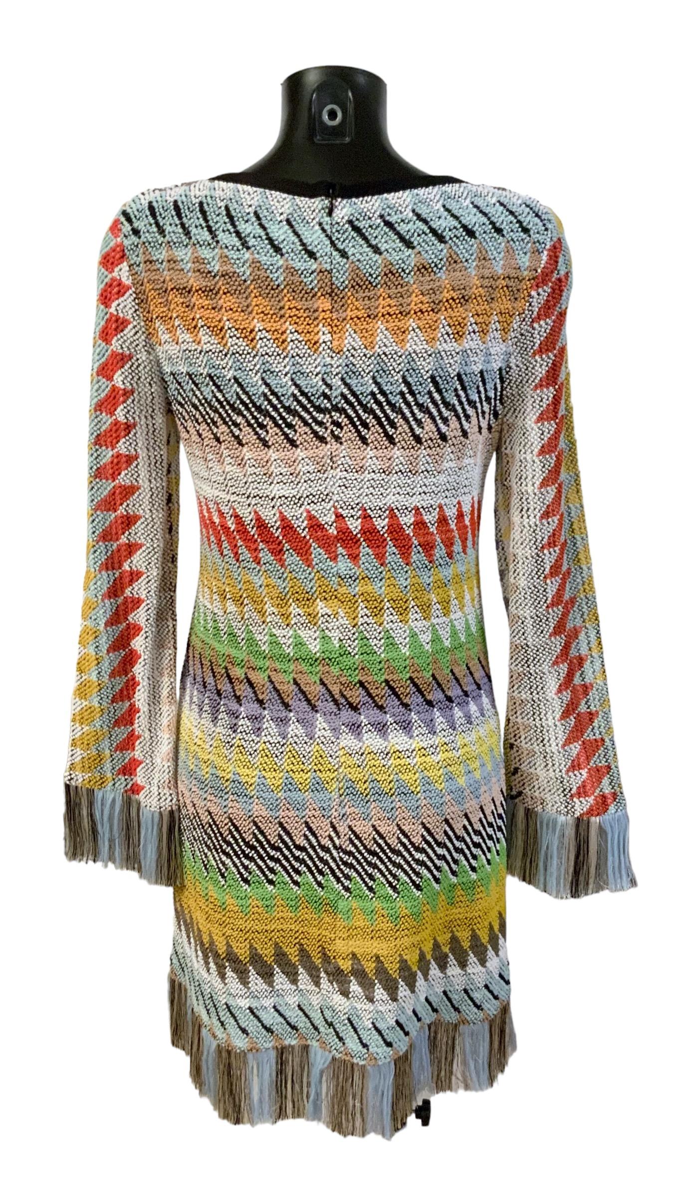 This beautiful knit dress from the house of Missoni is in excellent condition.
Crafted in the iconic zig-zag pattern knit, it features long sleeves and a fringe edging detail.
 
Material: 
Main:  72% cotton - 28% viscose
Trim: 70% viscose - 30%