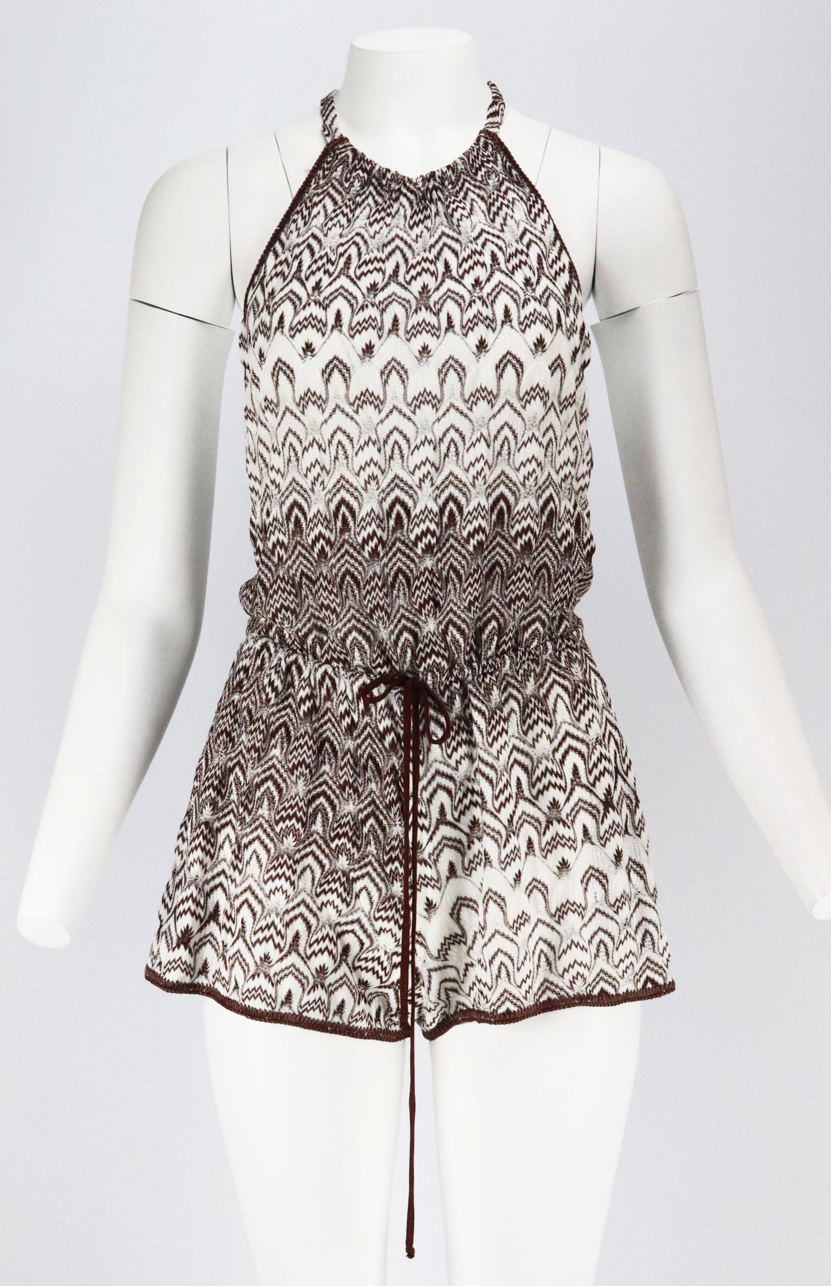 Missoni works to the timescales of the mill before anything else, this playsuit has been crochet-knitted in Italy using yarns in house's trademark a spectrum of colours, including brown and white in a halterneck silhouette with tie waist to cinch it