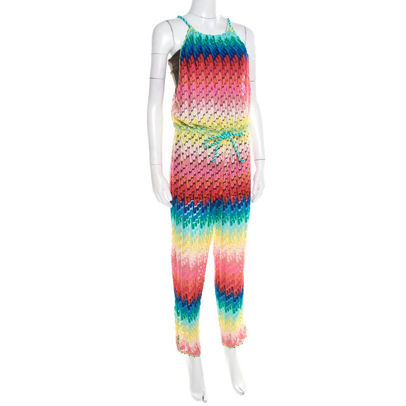 Be summer ready with this jumpsuit from Missoni Mare. It has been made from rayon and styled with rainbow patterned design all over and a sleeveless silhouette. A pair of thong sandals and a Panama hat will complete the look beautifully.

Includes: