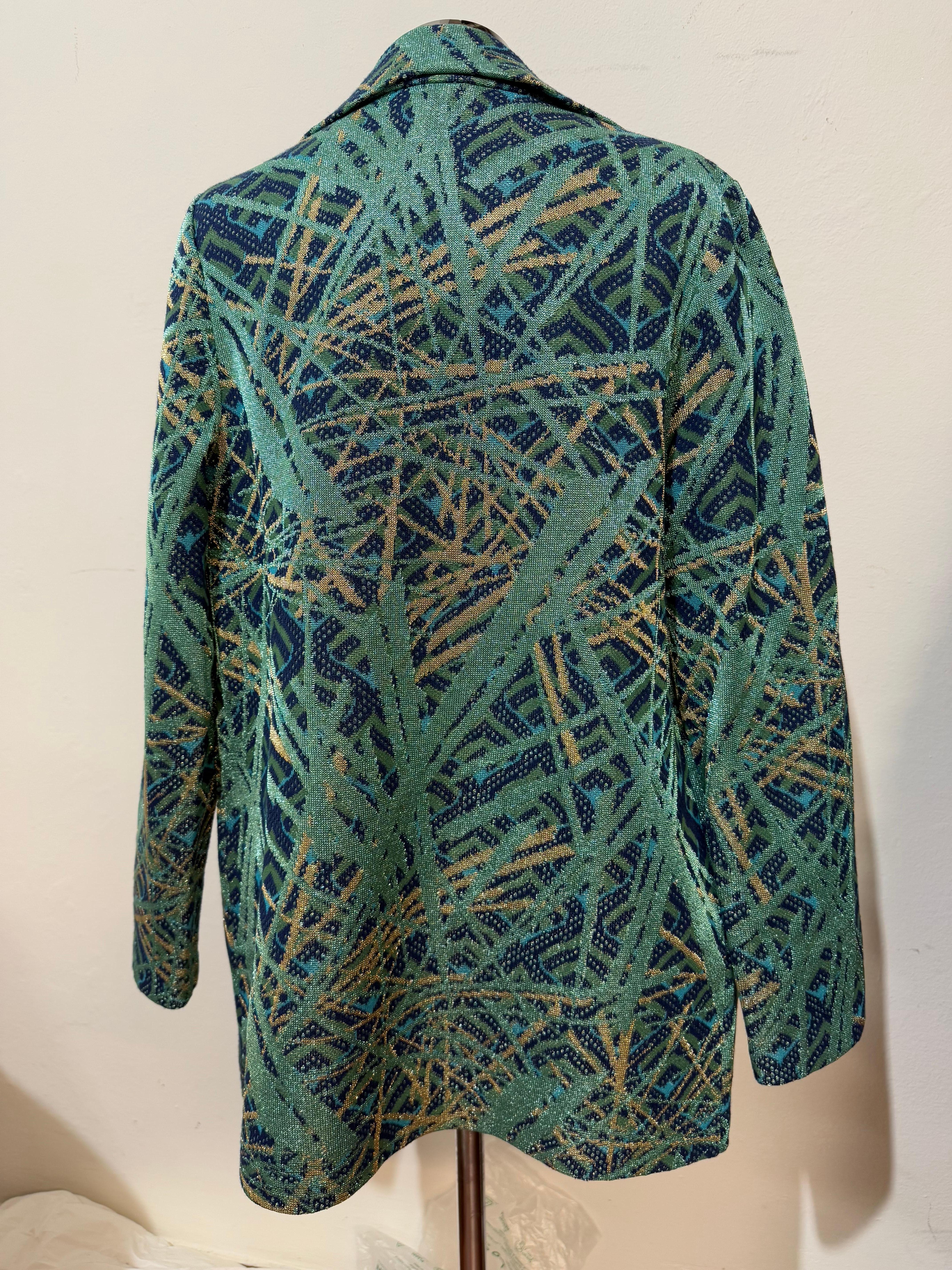 Top + Jacket set
M Missoni
Viscose (41%), cotton (29%), metal fiber (19%) and polyester
Fancy pattern
Metal green and gold color
Top size italian 40
Jacket size italian 42
Top length cm 58
Jacket shulder cm 38
Shoulder/hem cm 70
Two