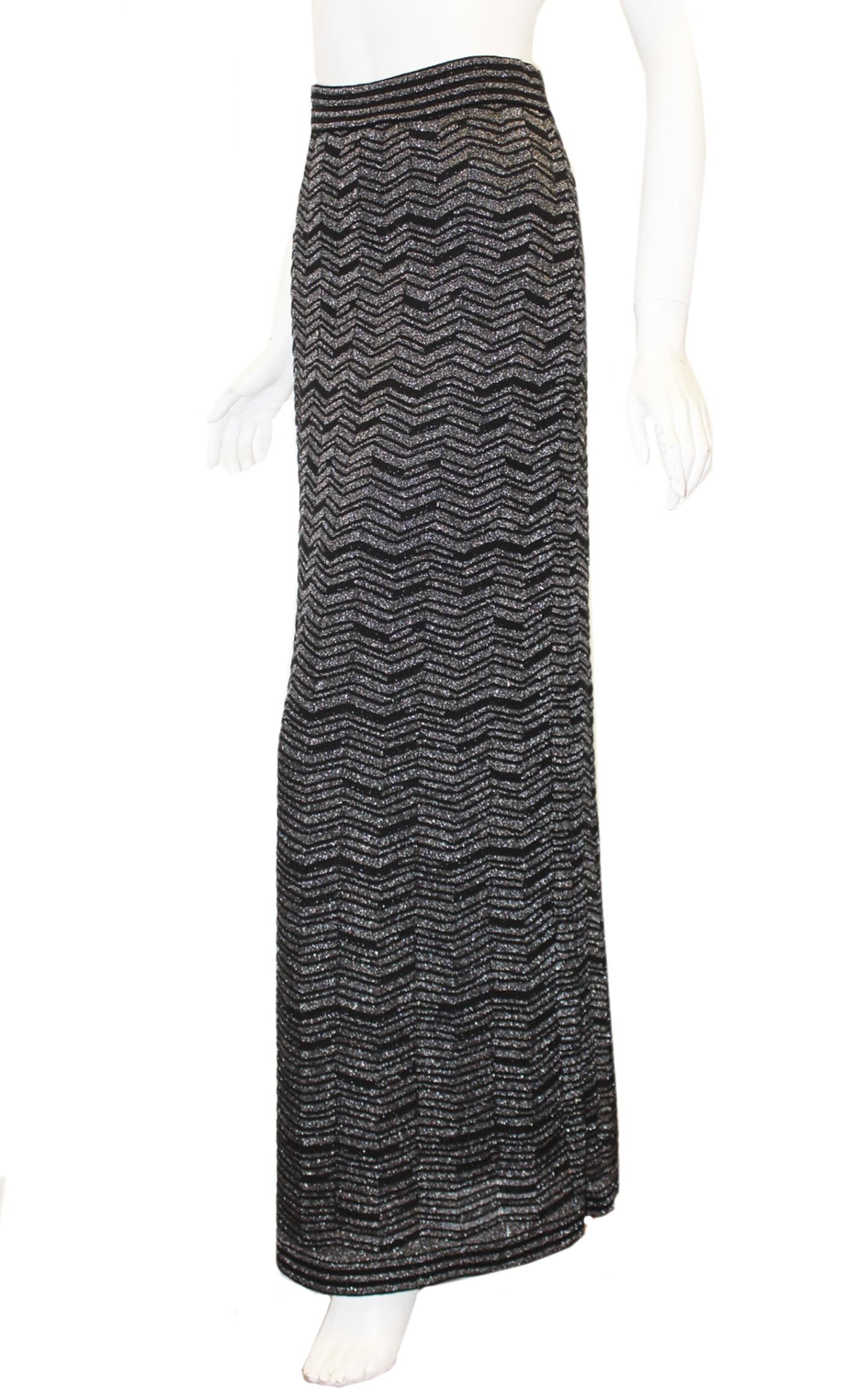 Missoni black skirt with silver tone metallic threads crocheted in the classic zig zag pattern that is the hallmark for Missoni.  This maxi skirt slips on and is cinched at waist with a concealed elastic band.  Skirt is lined in black poly fabric. 
