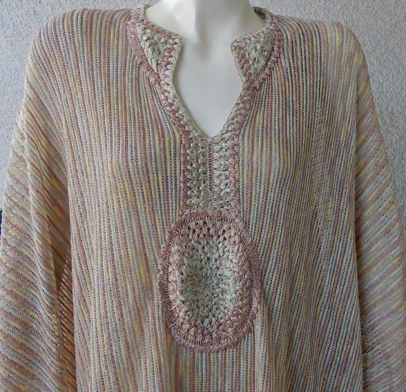 Missoni fashions are always in sync with jet set glamour.  An effortless caftan style dress.   Features Missoni signature multi pastel shades with slight metallic sparkle. Dress has a subtle gradual shading throughout.  A mid-weight knit accented by