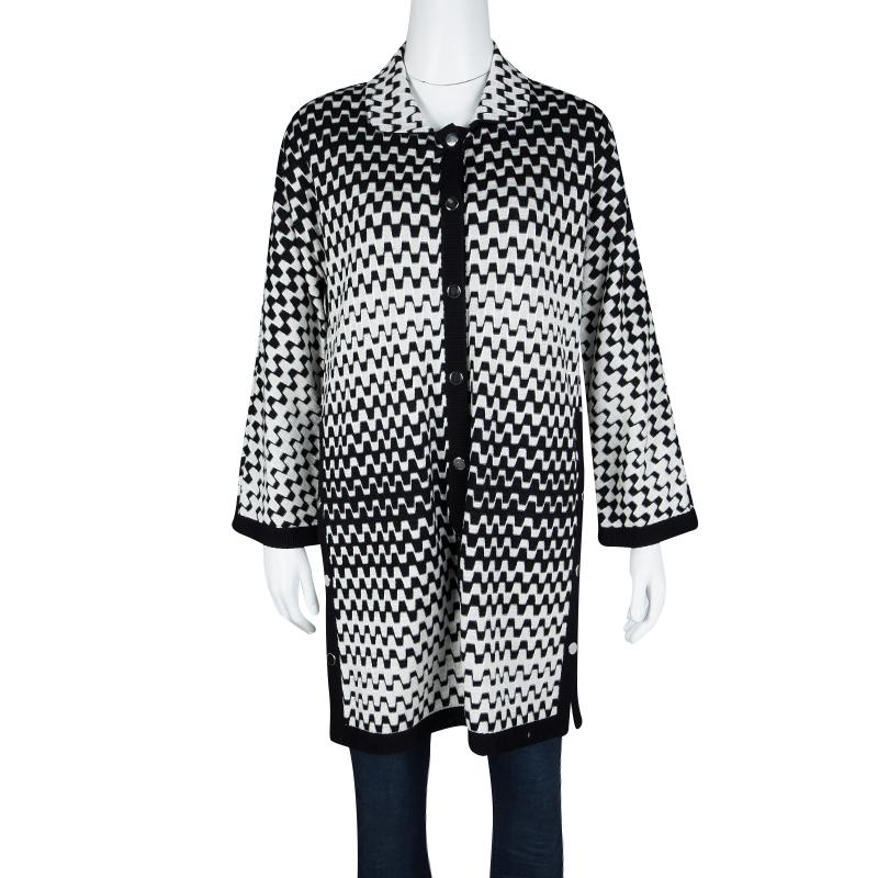 Missoni delights us with this wonderful wool-nylon cardigan tunic. It is styled with front buttons, long sleeves, and monochrome patterns all over. The textured cardigan tunic will be an ideal addition to your closet.

Includes: The Luxury Closet