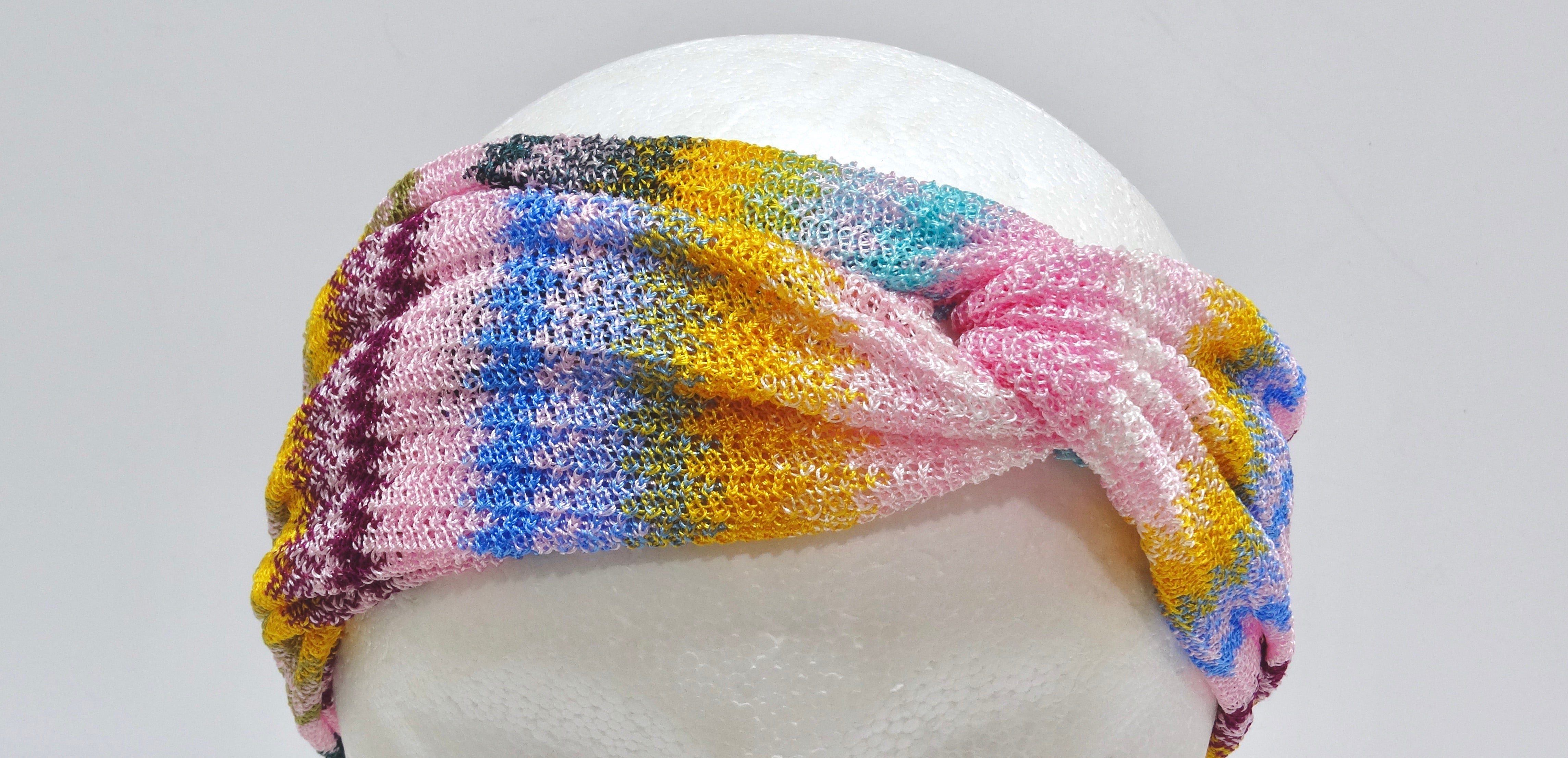 This MISSONI multi-color knotted headband is made in the signature chevron-pattern giving the chic and trendy Missoni signature. This designer accessory is the perfect summer accessory to add to your wardrobe. This headband is crafted in a