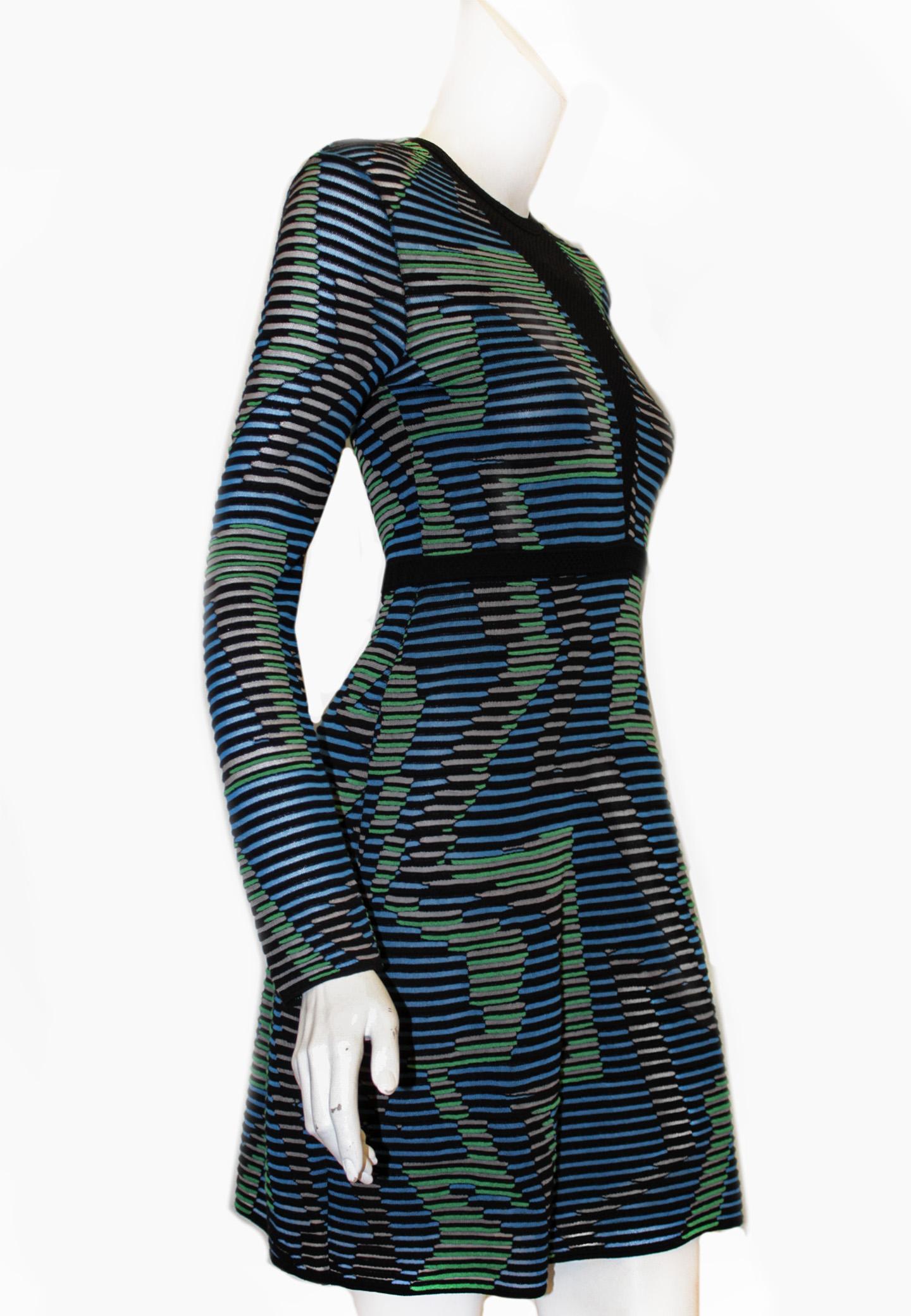 Missoni multi color knit dress conceptual zig zag design in black, turquoise blue and green is authentic to the Missoni brand.  With an open knit neckline in black from neck to waist, intensifies the quirky and forceful concept.  The dress slips on