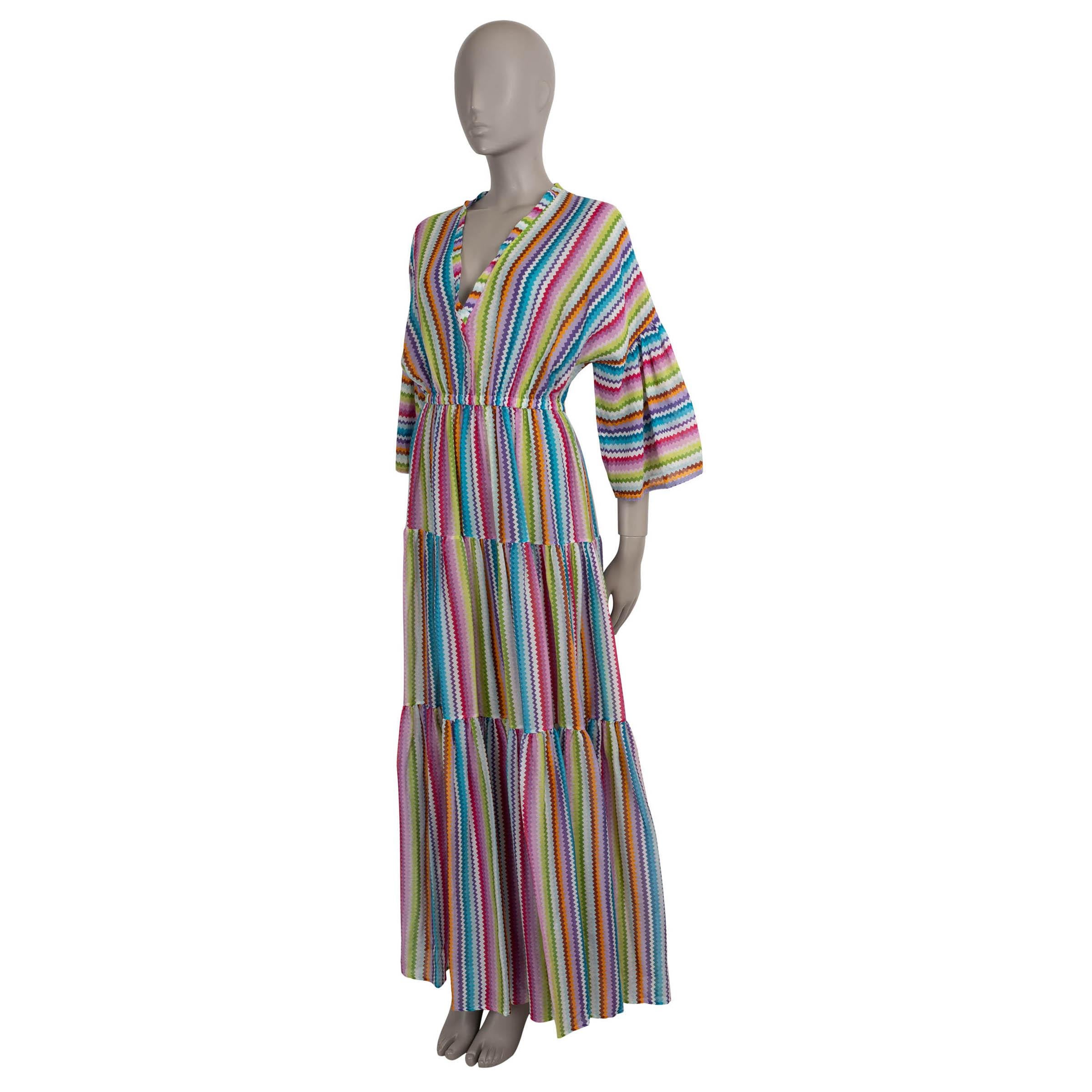 This 100% authentic Missoni dress is crafted in a vibrant multicolor zigzag cotton (78%) and silk (22%) blend, embodying the house’s signature textile artistry. Designed with a relaxed silhouette, it features a flowing maxi length, dropped