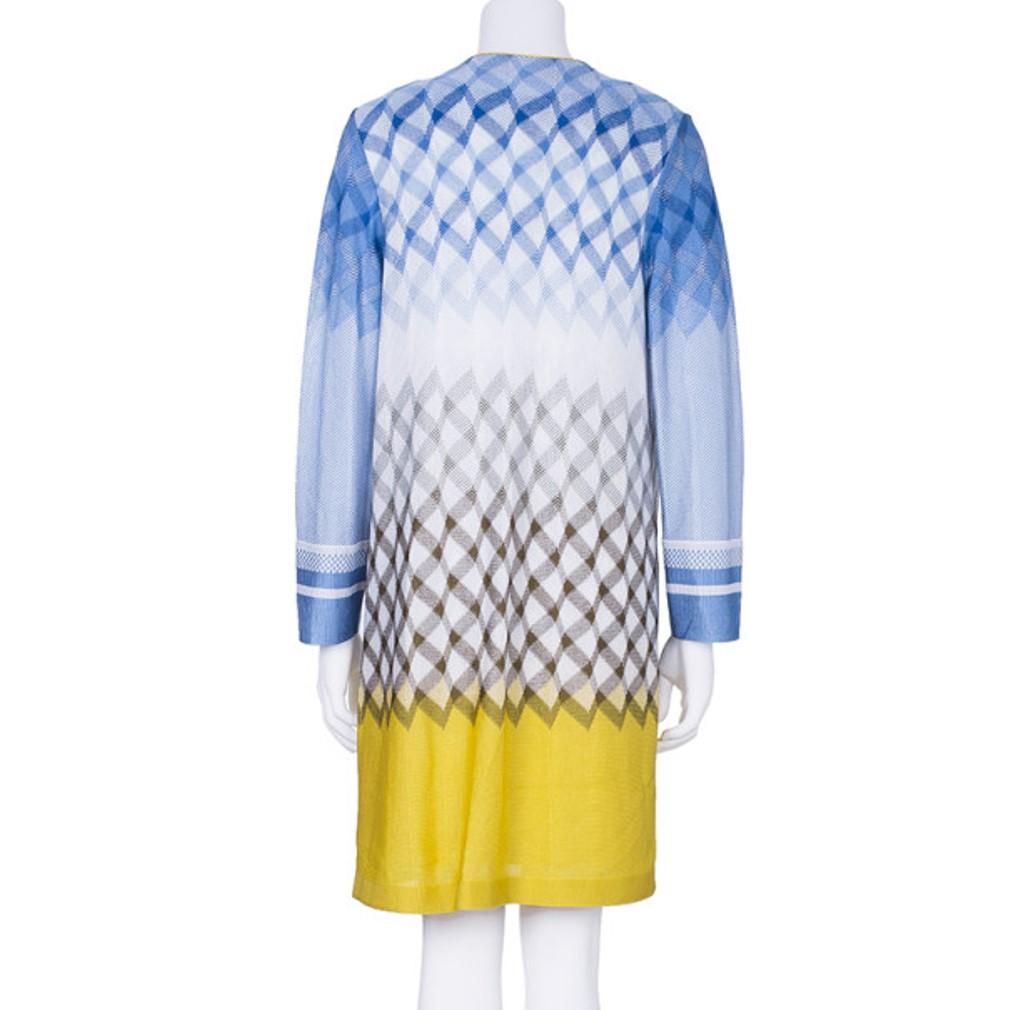 Coordinated sets are all the fashion this season, so be on trend with this multicolor Missoni knit zig-zag dress and cardigan set. It features a cool zig-zag pattern in light blue, white and yellow colors on both the cardigan and dress. The cardigan
