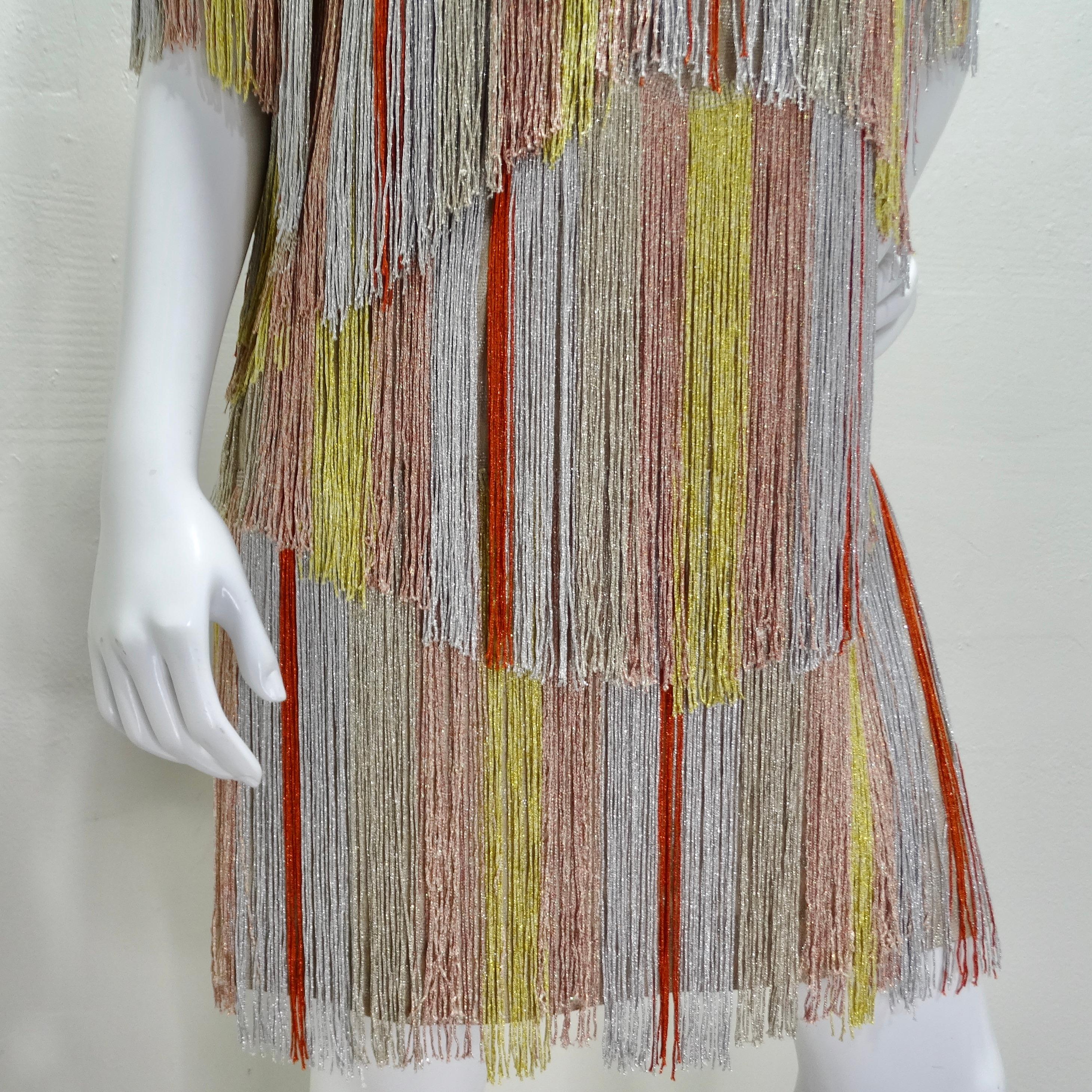 Step into the spotlight with the dazzling allure of the Missoni Multicolor Metallic Fringe Dress. This statement piece exudes the unmistakable charm of Missoni with its signature chevron knit base adorned with layers of vibrant multicolor