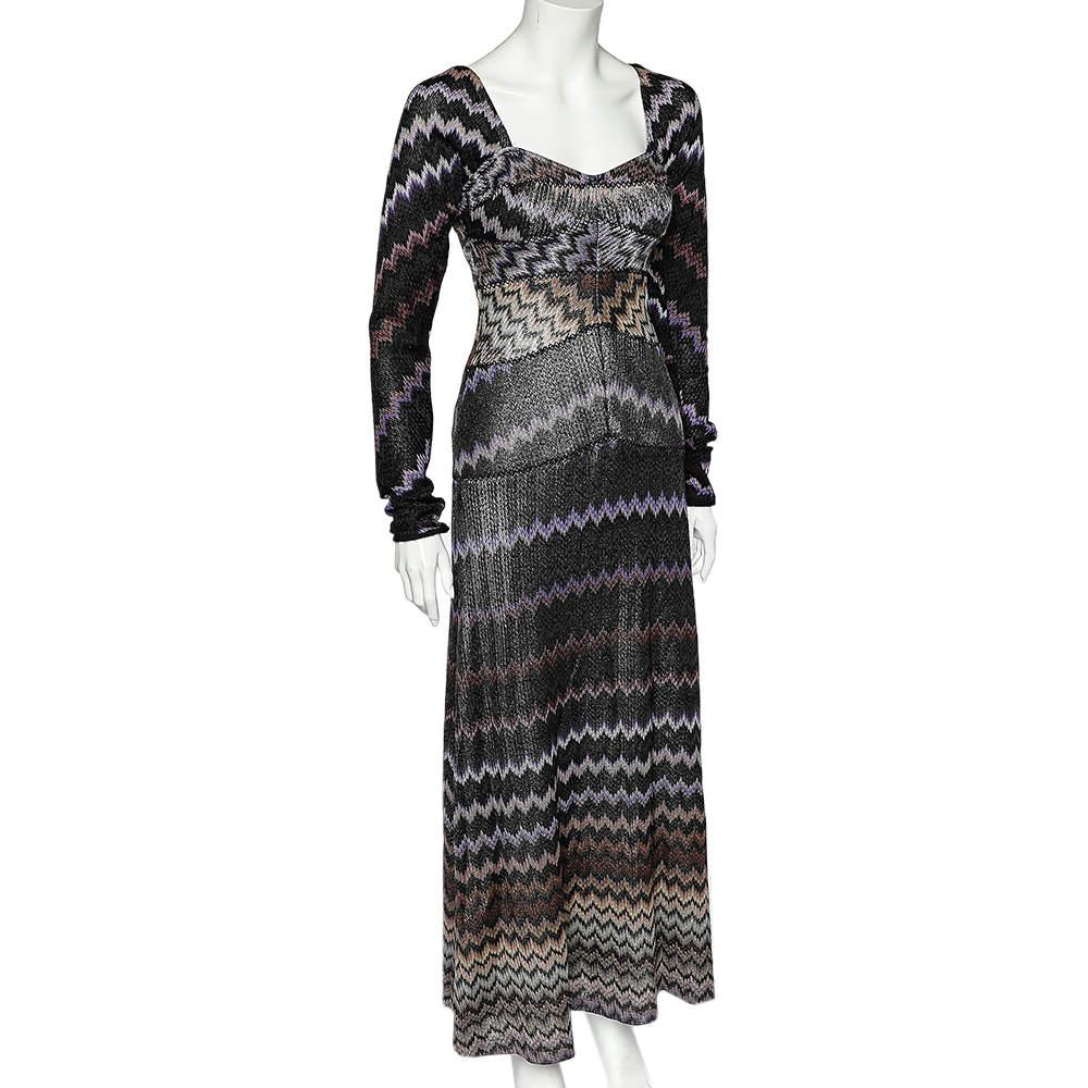 Characteristically feminine and timelessly elegant. Missoni's maxi dress presents the beauty of simplicity through high-quality materials and fine knitting. It has a defined waist, a zip closure, long sleeves, and patterns all over.

