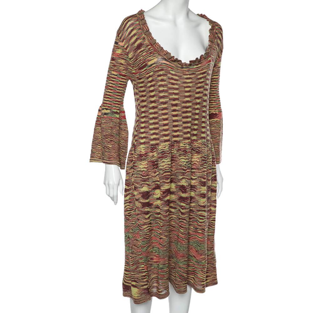 This midi dress from Missoni is a perfect mix of style and luxury. It is stitched from wool and knit fabric and features a multicolored pattern all over. The artistic-looking dress is finished with a pleated silhouette at the bottom, giving it a