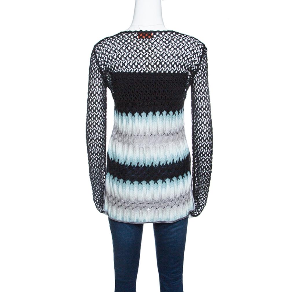 This one is an awesome piece from the house of Missoni. Fabulously crafted, this gorgeous top is adorned with perforated knitting and multicoloured patterns. Channel a fun, feminine vibe by styling it with a midi skirt and block heel