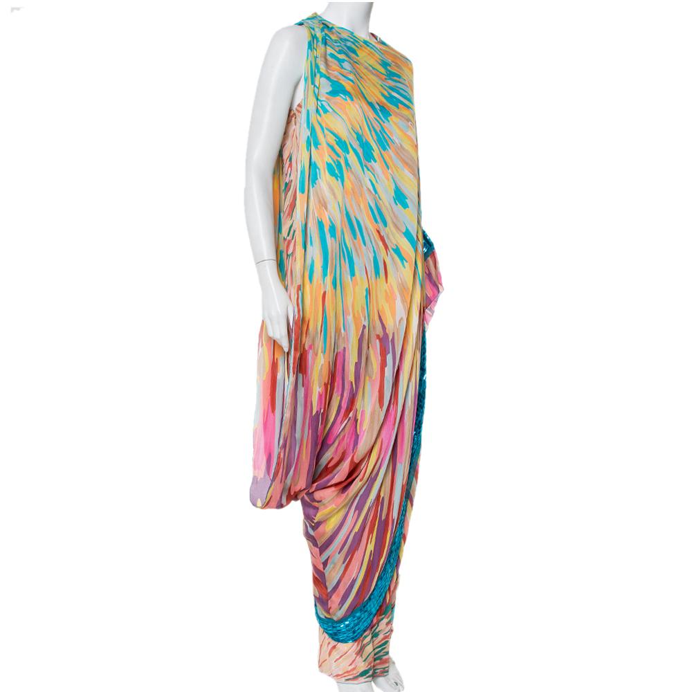 A burst of colorful prints and a beautiful design make this Missoni maxi dress into a fashionable creation. It has a cape detail. embellished trim, and a zip closure. Pair the maxi dress with flats or dainty mules to continue the elegant charm.

