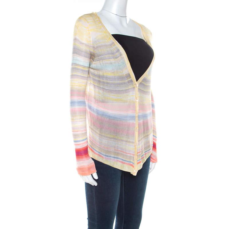 This exquisitely designed sweater by Missoni captures casual aesthetics with modern style. It is beautifully knit and styled with front buttons, long sleeves and colourful stripes that evoke an image of rainbows. The cardigan will be a lovely