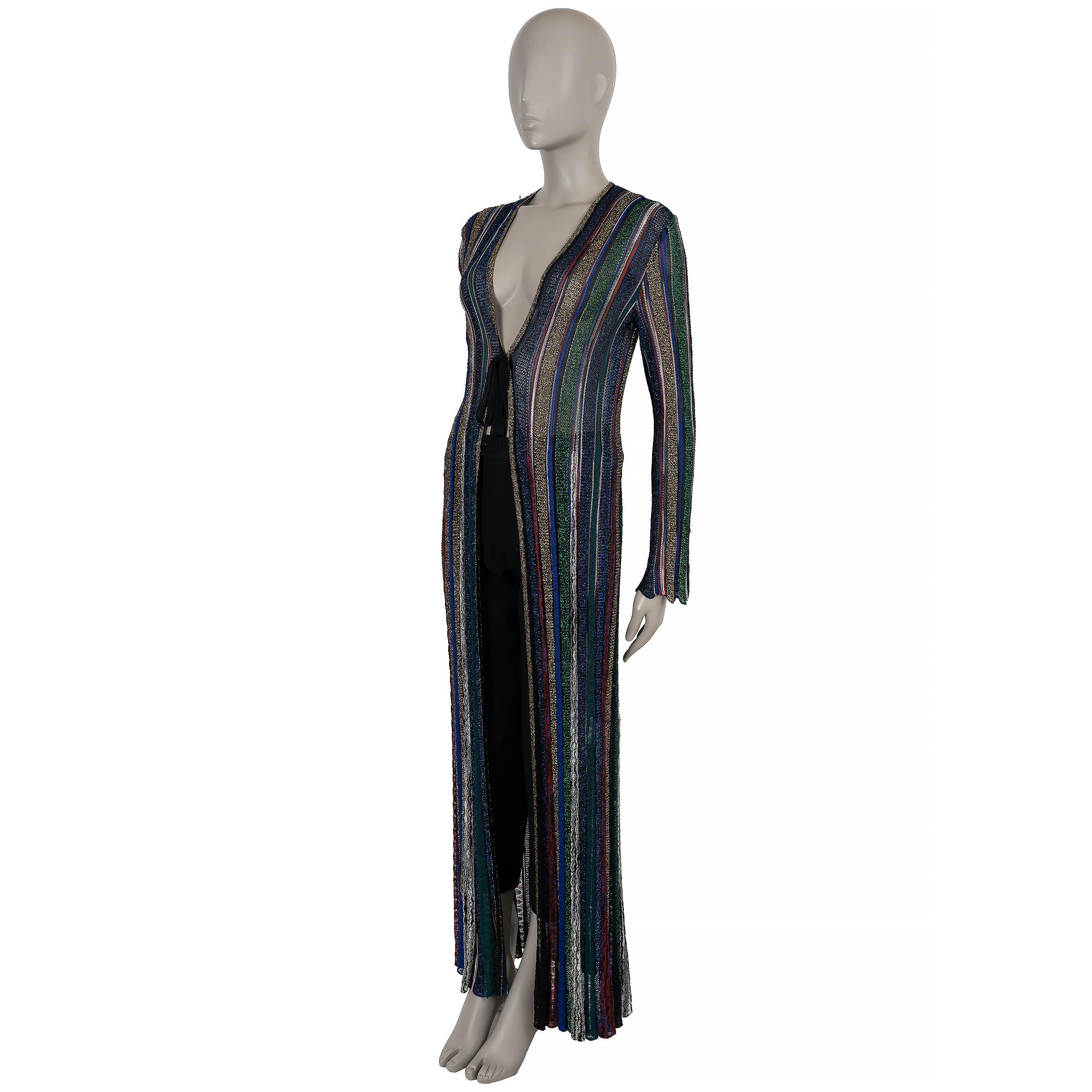 This 100% authentic Missoni long knit cardigan in multicolored striped viscose blend with gold lurex captures the brand’s signature vibrant aesthetic. Designed with a fitted, maxi-length silhouette, it features a deep V-neck and ties elegantly below
