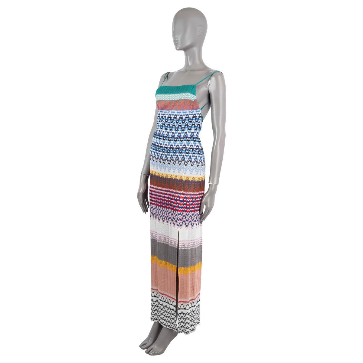 100% authentic Missoni maxi knit dress in multicolored viscose (100%) with stripes of the houses signature chevron knit. Features spaghetti straps, an open back and high slit on the side. Closes with a zipper in the back and is lined in silk (with
