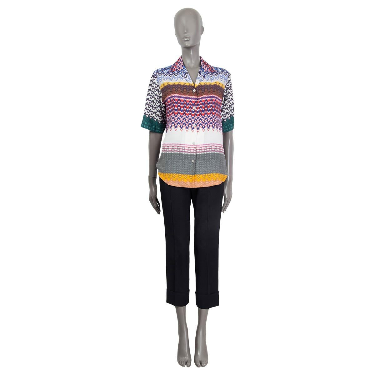 100% authentic Missoni wavy zig zag short sleeve shirt in blue, green, red, yellow, gray and pink viscose (75%) and silk (25%). Opens with five silver metal buttons on the front. Unlined. Brand new, with tags.

Measurements
Tag