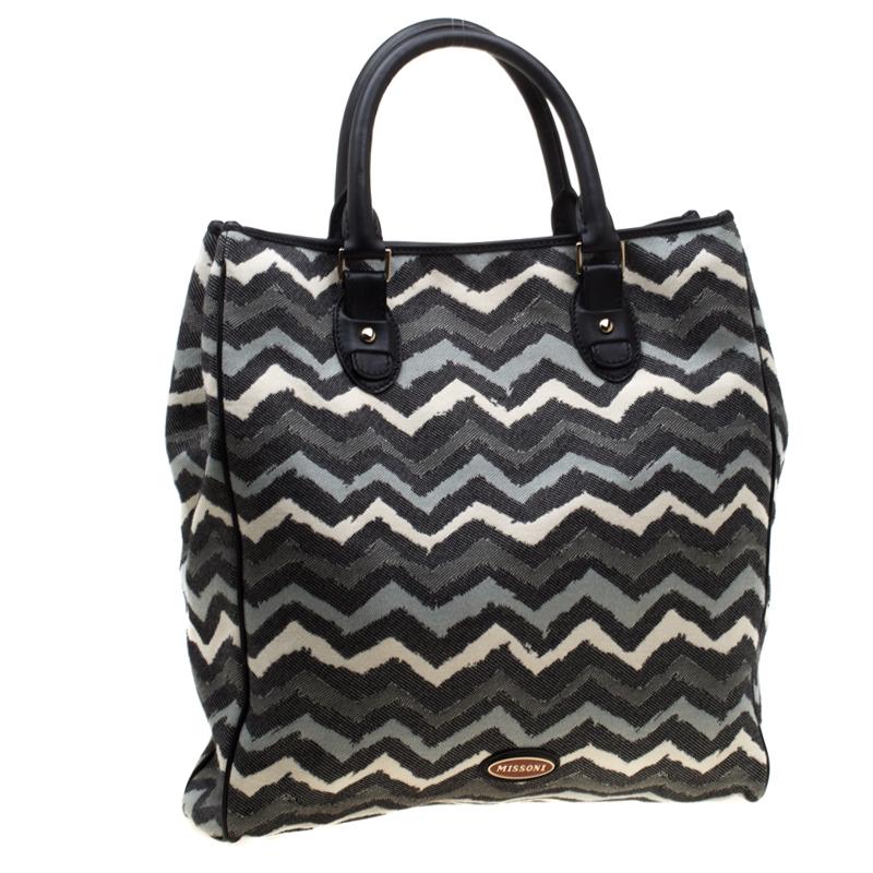 Made from wave-printed canvas with leather trims, this tote from Missoni is reliable and packed with style. It comes with a spacious fabric interior and two top handles. Complete your look with a pinch of fun style by carrying this multicoloured