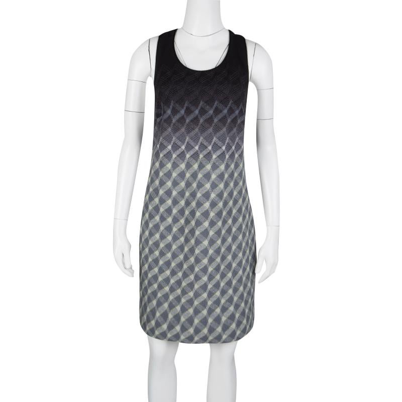Missoni will never fail in providing the most classic outfit and one of them is this gradient and wavy printed one-piece. It has a racer back detail in color block pattern and a hollow out waistline. The knee length dress is provided with straight