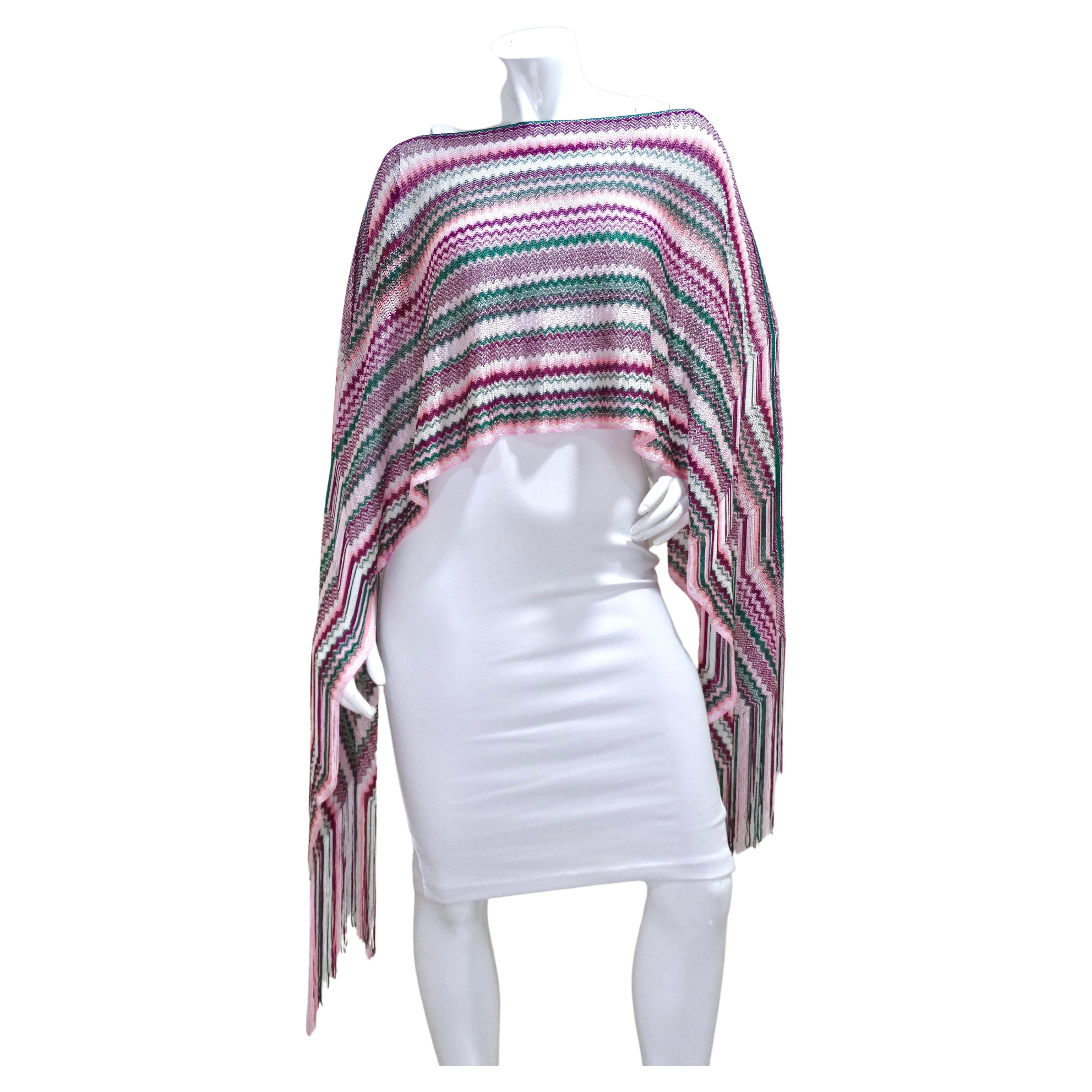 Missoni is known for their iconic and playful knits and this cropped poncho is an emblem of the brand. The cropped length gives a fresh take on a poncho and the fringe details adds a fun and flirty aspect. This top is versatile as it could be worn