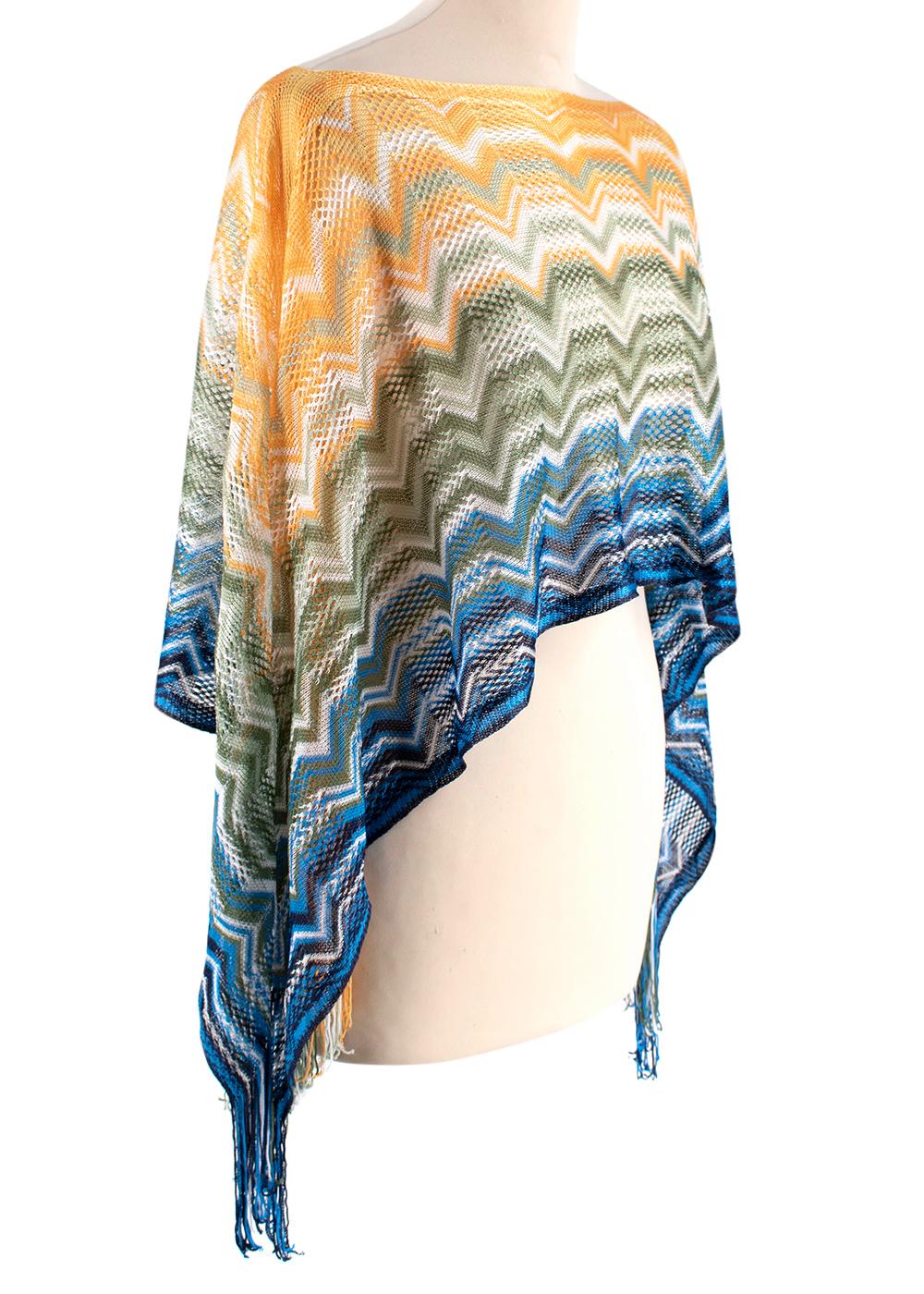 Missoni Multicolour Knit Cropped Poncho

- Lightweight scarf/mini poncho
- Fringes on the sides
- Striped pattern with metallic threading
- An easy layering look for warm-weather outfits

Materials:
100% Viscose

Dry clean only
Made in Italy

Length