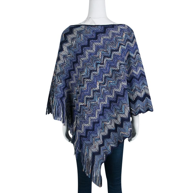 The chunky knitting and chevron pattern of this Missoni poncho echo label's penchant for patterns and motifs forming a stylish layer to wear for the new season and beyond. It is styled in navy blue hue with fringed edges. Drape it over your casual