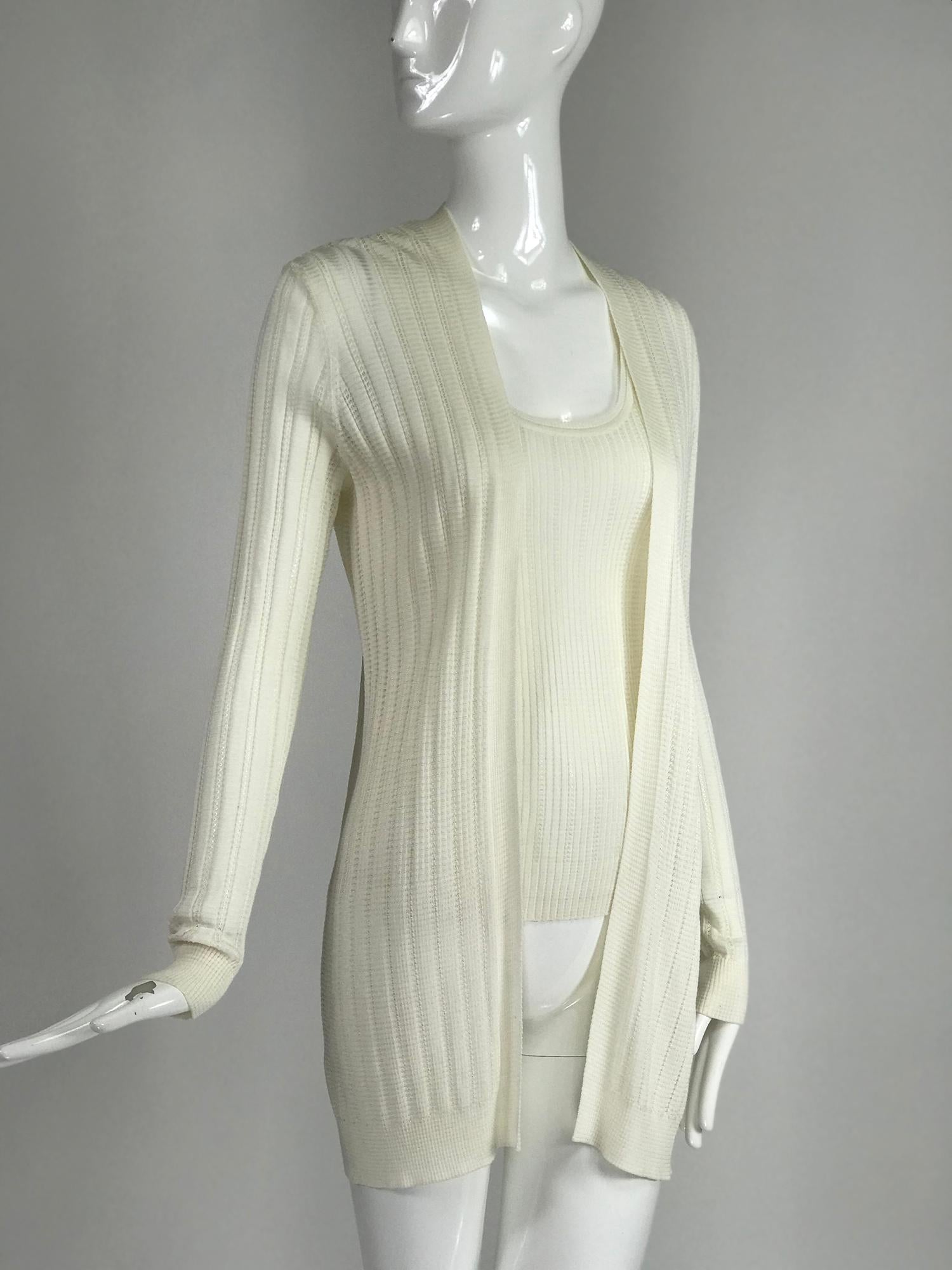 Missoni off white decorative knit long sleeve open front hip length sweater and matching scoop neck tank top. Each unlined. Tank marked size 2 sweater marked size 6. M Missoni.
In excellent wearable condition.  All our clothing is dry cleaned and