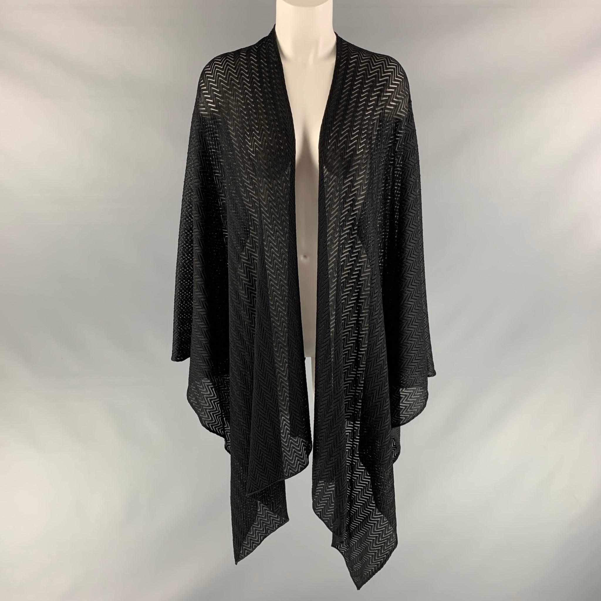 MISSONI open front cardigan comes in black herringbone fabric featuring asymmetrical bottom. Made in Italy.

Very Good Pre-Owned Condition. Fabric Tag Removed.
Marked: no size marked.

Measurements:

Shoulder: 18 in.
Sleeve: 21 in.
Length: 26 in. 

