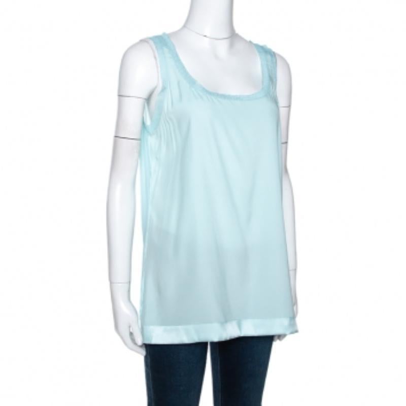 This stylish creation comes from the house of Missoni. Crafted from a silk blend, it comes in a lovely shade of pastel blue. This sleeveless top has a scoop neck, relaxed fit and flattering silhouette. It is great for fun outings with friends.